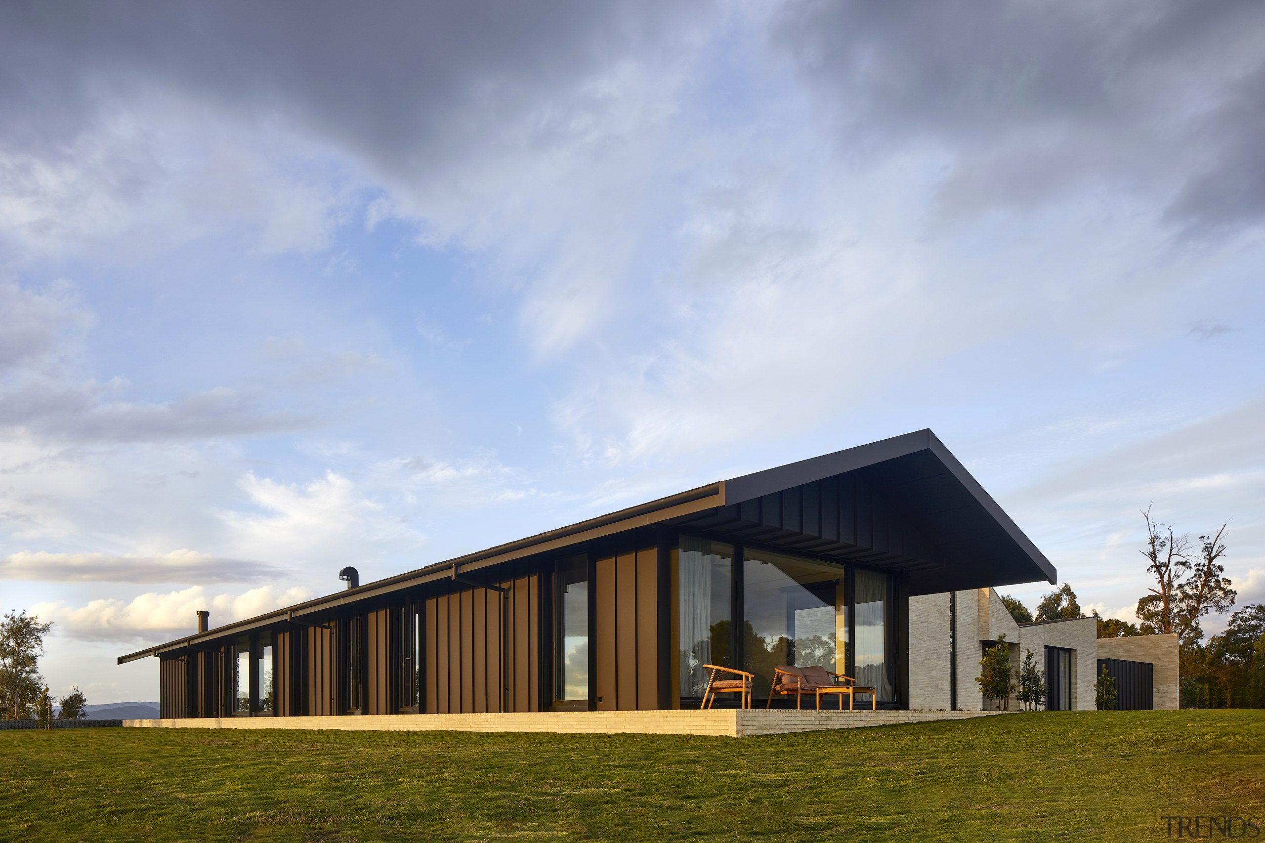 The steel-clad bedroom pavilion with the central brick-faced 