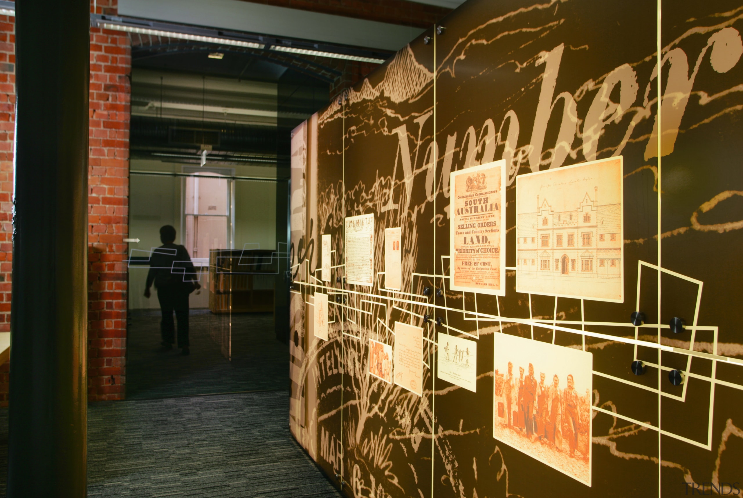 graohic panelling greets visitors at the building entrance exhibition, brown