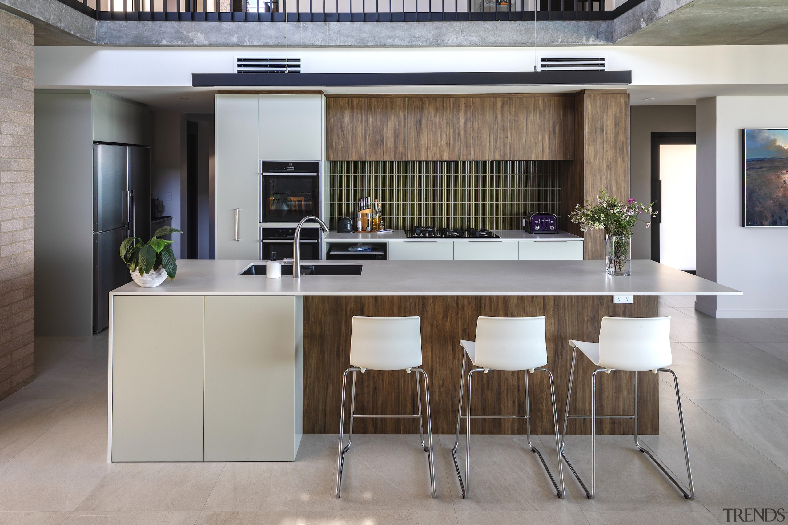 While the home is sculpturally dynamic, the material 