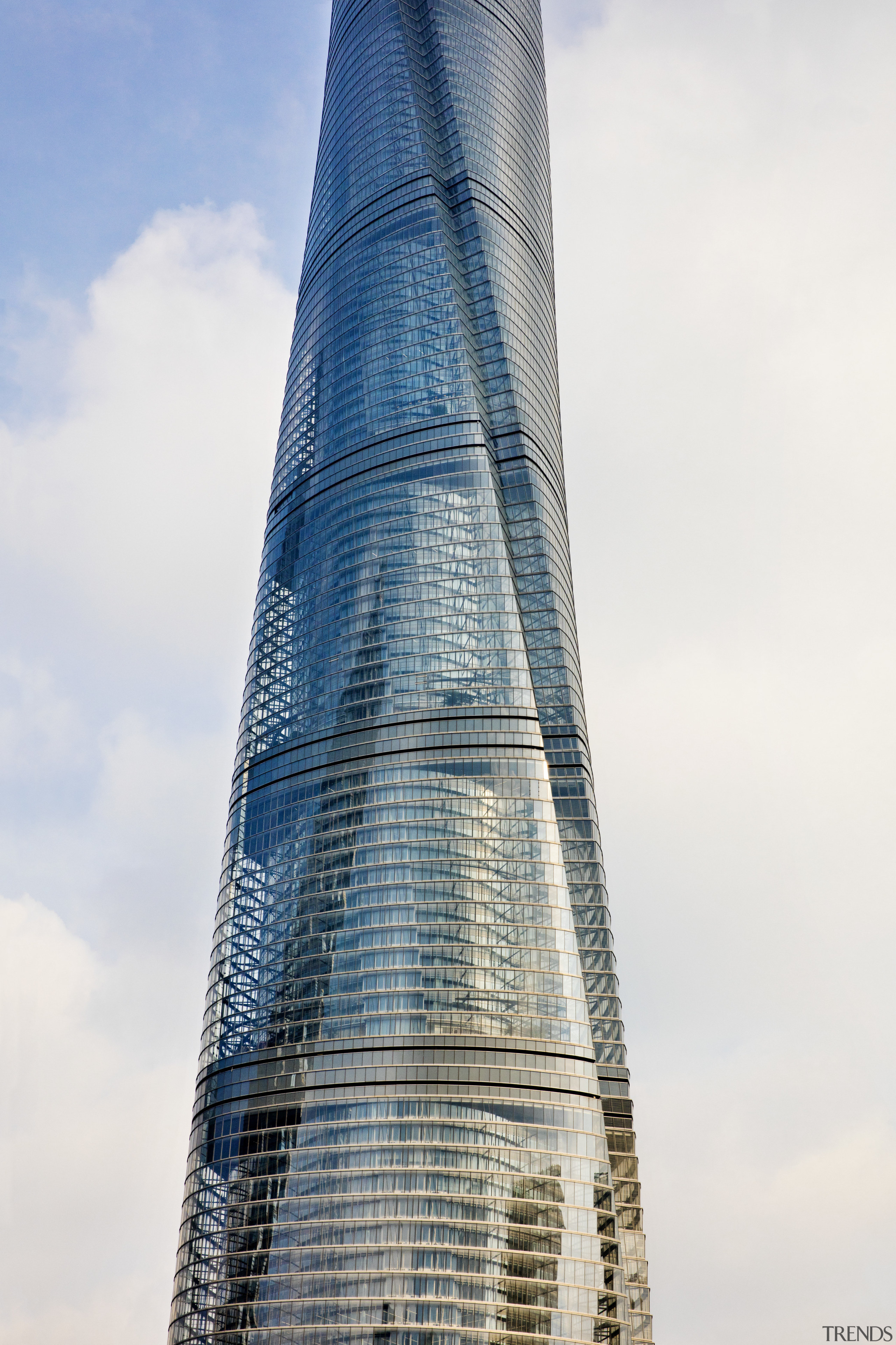 Structurally, the Shanghai Tower consists of a stack architecture, building, condominium, corporate headquarters, daytime, landmark, metropolis, metropolitan area, sky, skyscraper, spire, tower, tower block, white