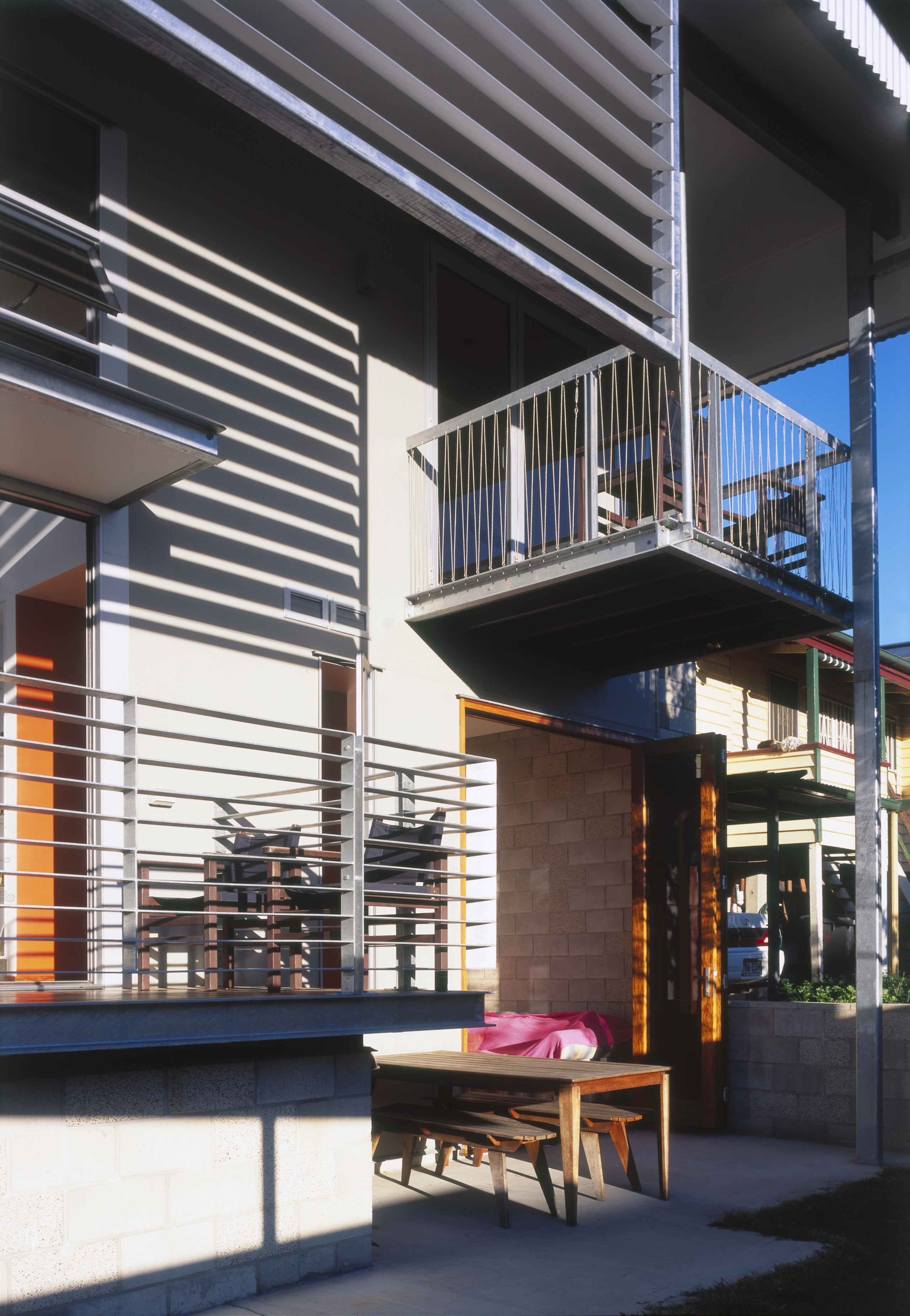 Exterior view of this renovated Brisbane home which architecture, building, facade, house, stairs, black