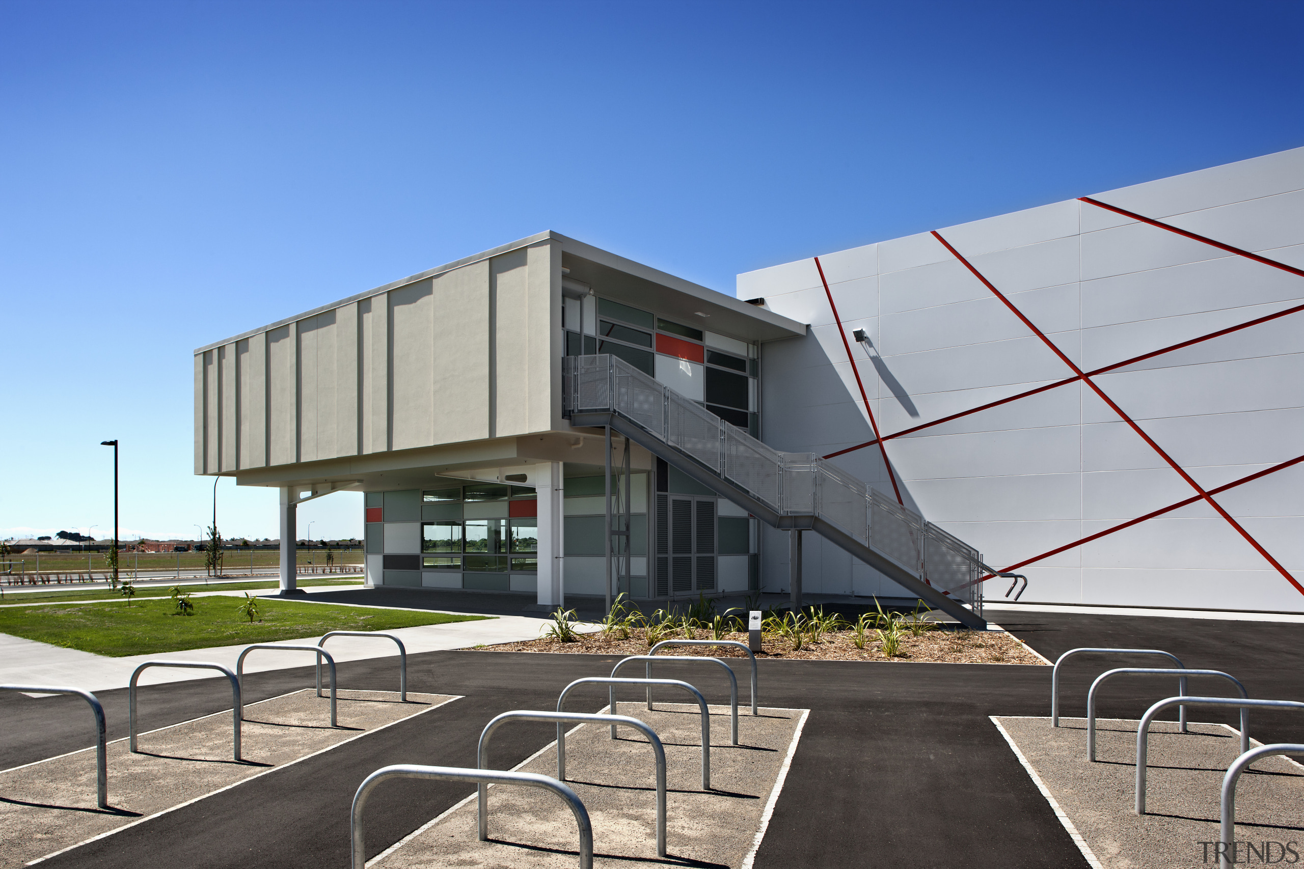 View of exterior with bike racks. - View architecture, building, commercial building, corporate headquarters, facade, headquarters, mixed use, real estate, residential area, sky, structure, gray