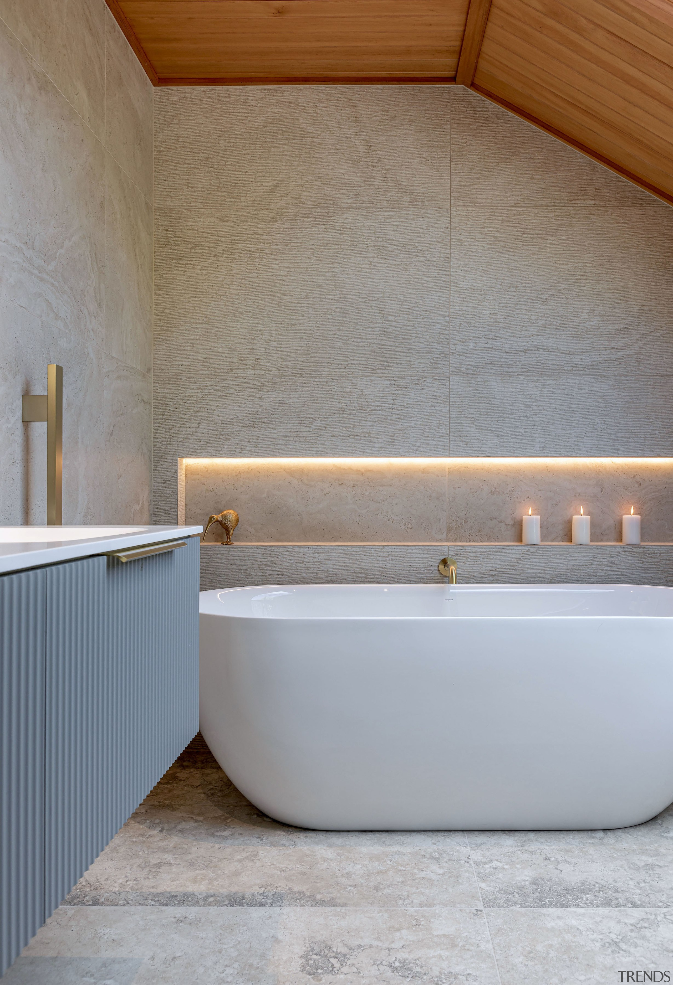 The freestanding tub takes up less space while 