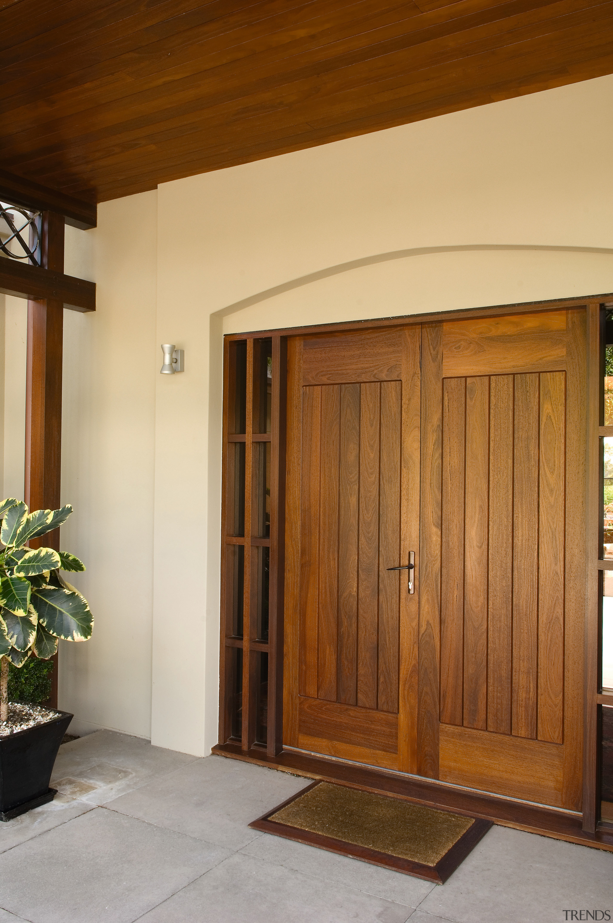 This home, designed by architect Colin Duckett of door, hardwood, real estate, window, wood, wood stain, brown