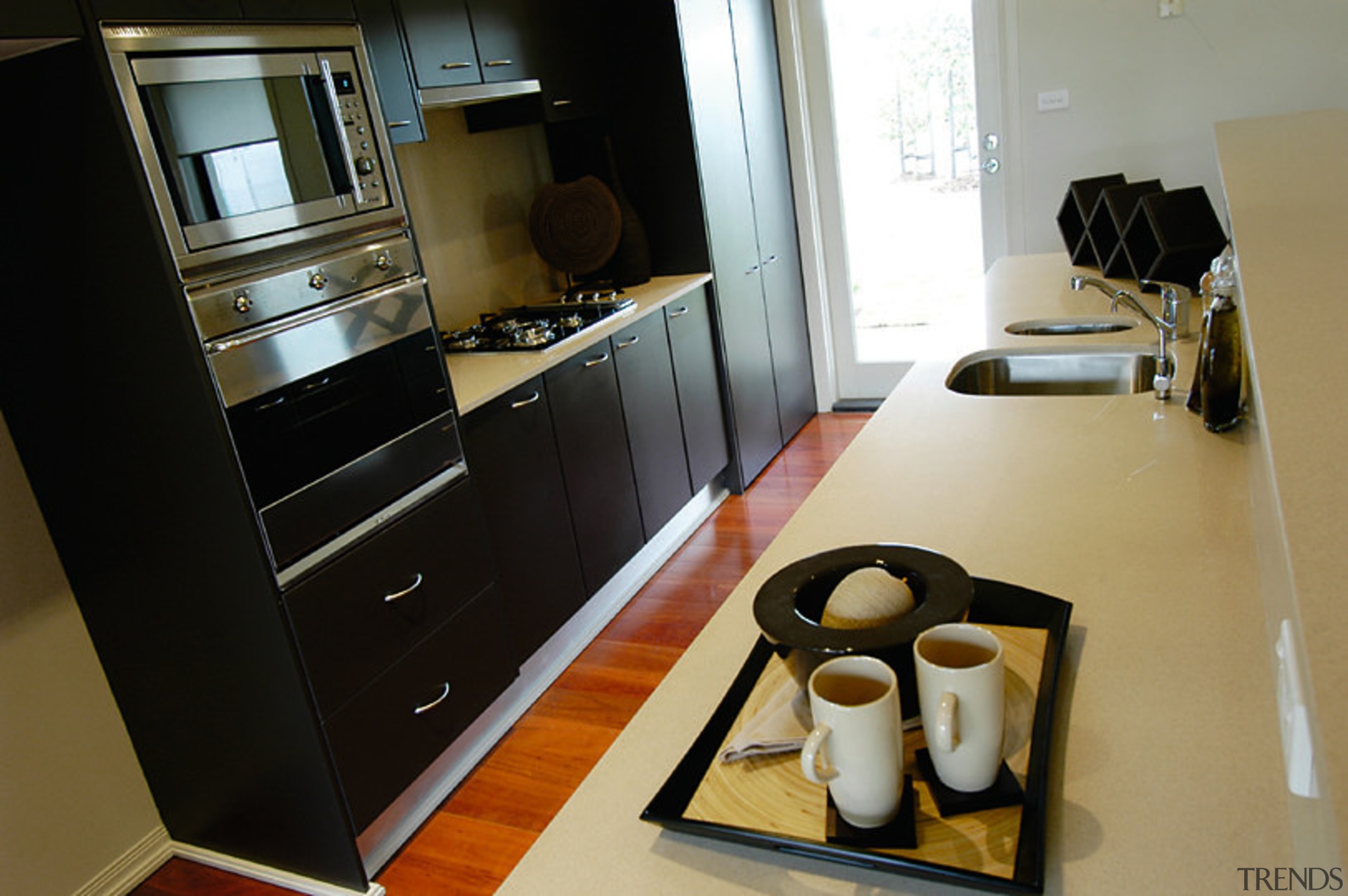 View of the kitchen - View of the countertop, furniture, home appliance, interior design, kitchen, room, black