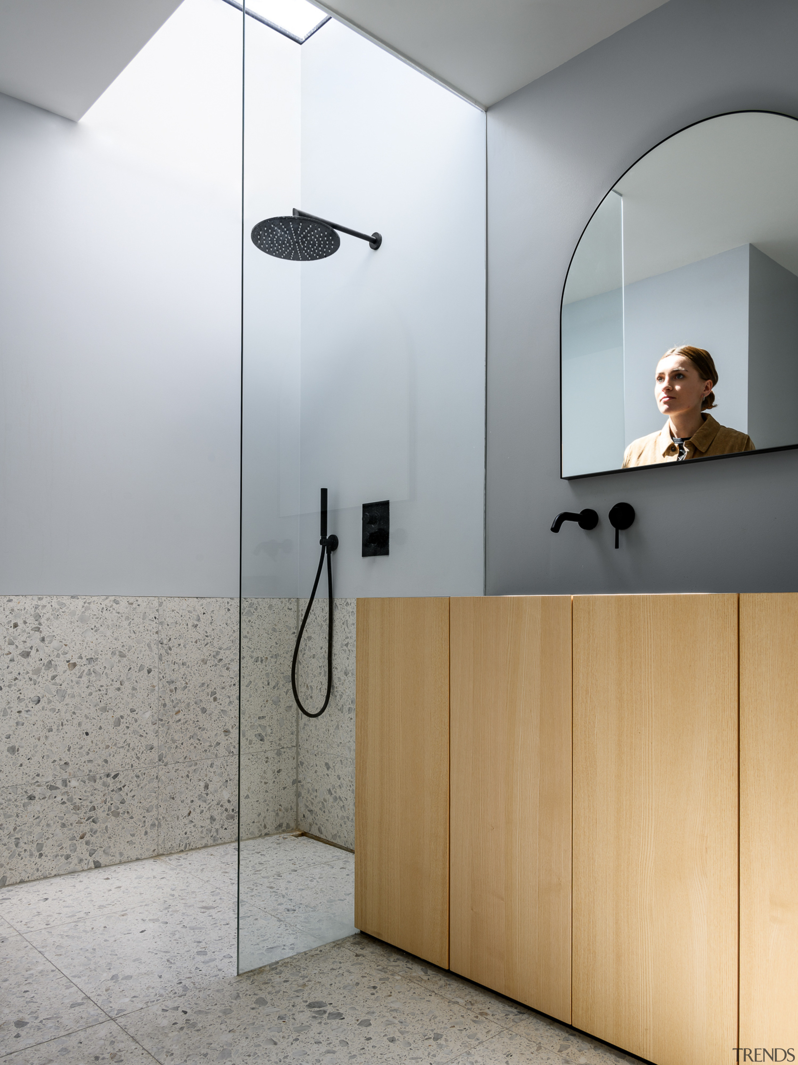 A skylight is positioned directly over the shower 