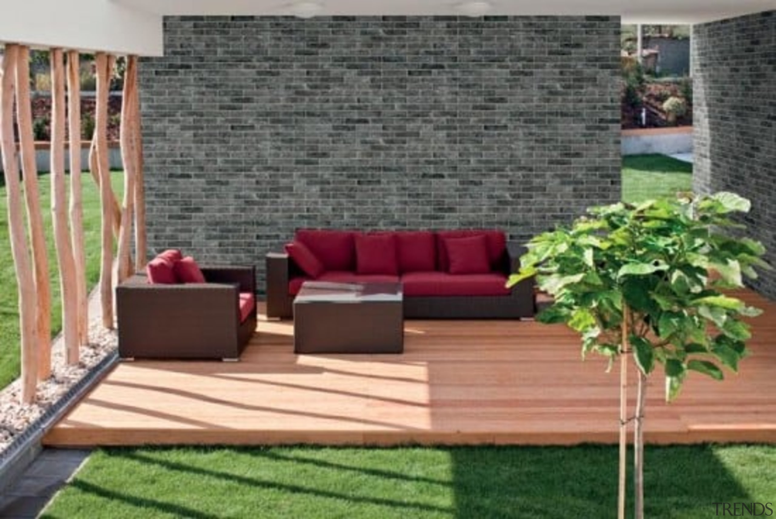 Brick One will never require sealing and is backyard, couch, floor, flooring, furniture, grass, hardwood, outdoor furniture, outdoor structure, patio, table, wall, wood, gray