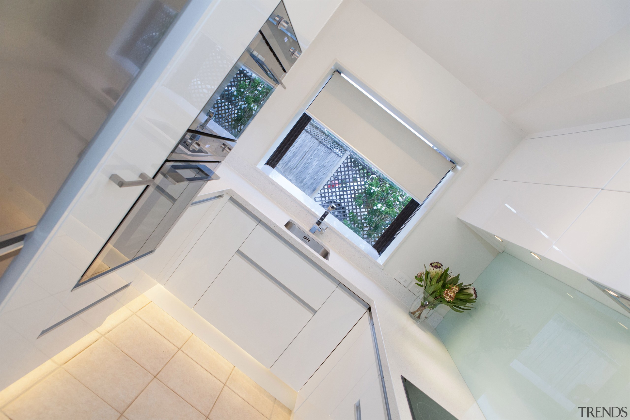 This small kitchen was completely transformed by kitchen architecture, bathroom, daylighting, floor, home, house, interior design, property, real estate, room, window, gray