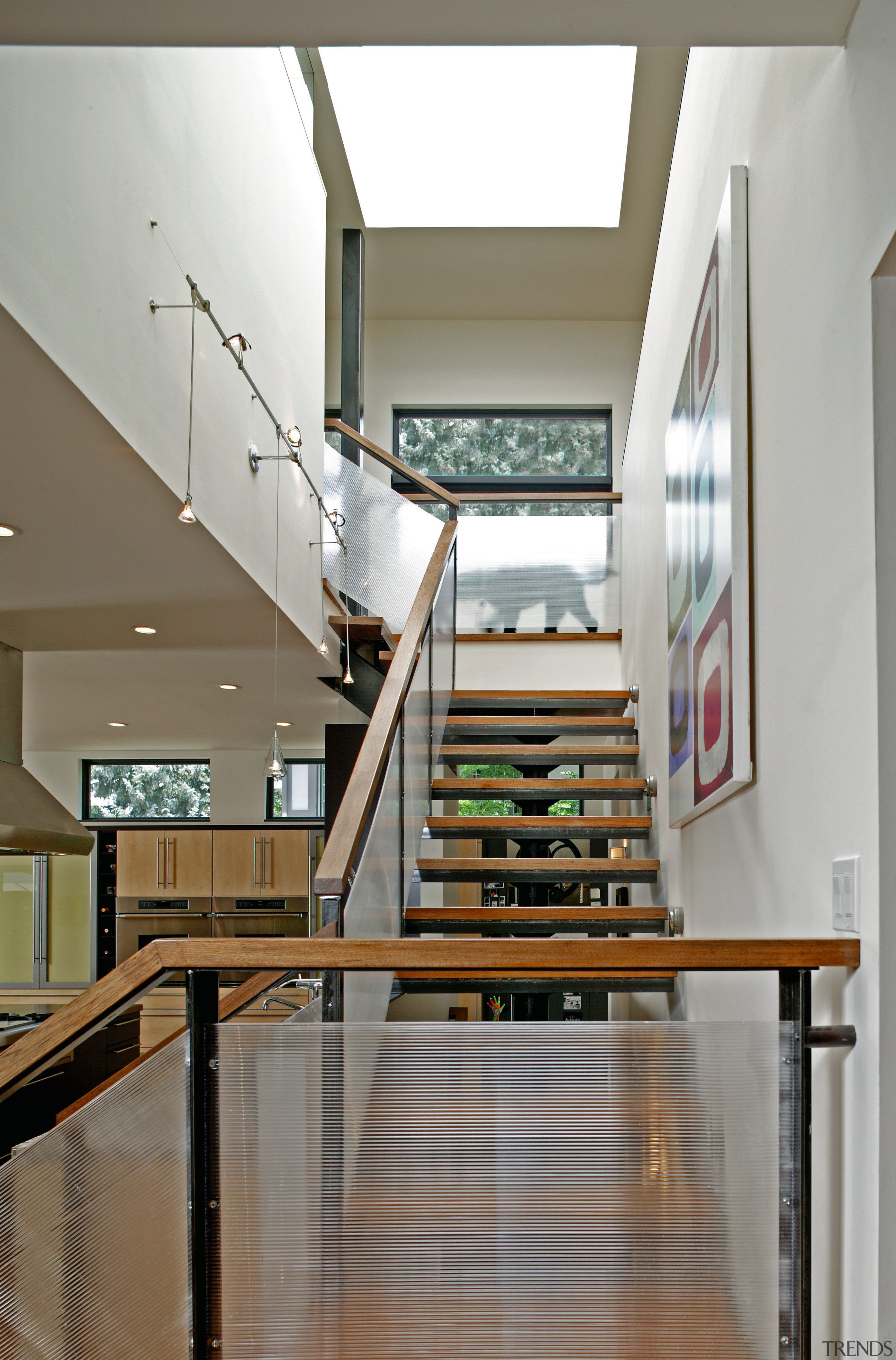 A view of the staircase that opens  apartment, architecture, daylighting, glass, handrail, house, interior design, stairs, wood, gray