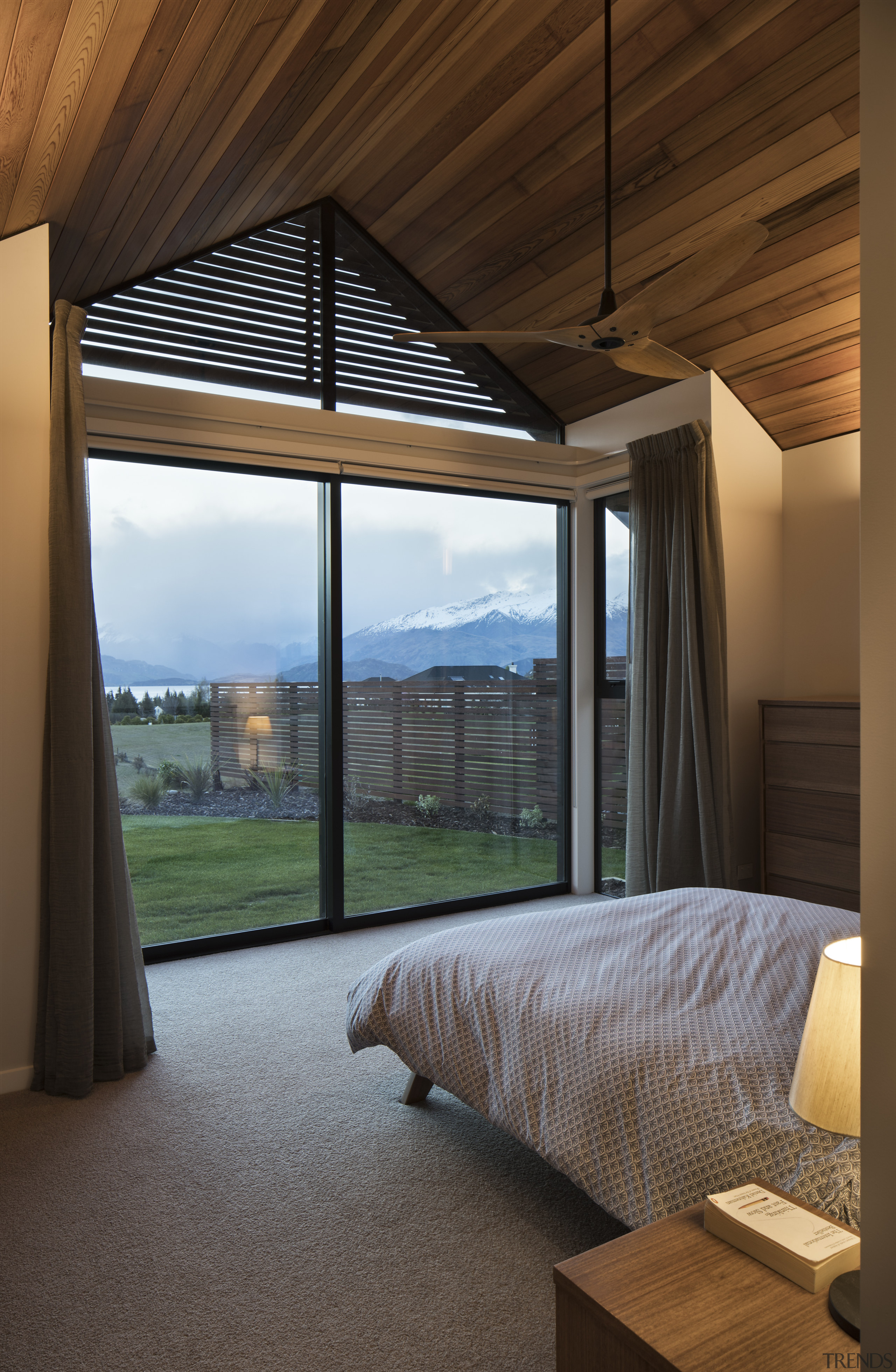 ​​​​​​​Shutters under the eaves of this master bedroom architecture, bed, bedroom, furniture, home, house, interior design, shutters, Condon Scott