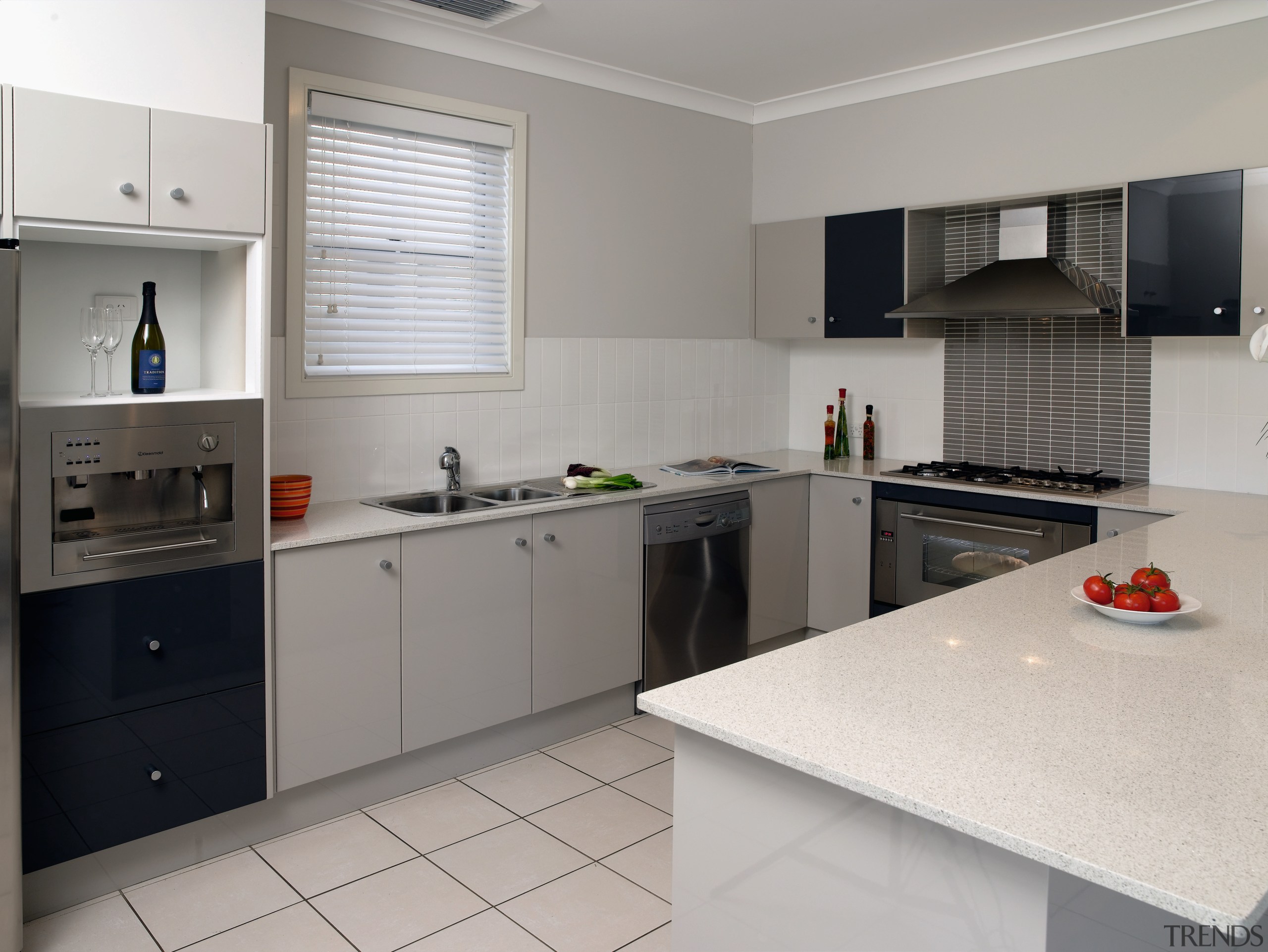 Kitchens in the Tullimbar Village development are as cabinetry, countertop, interior design, kitchen, real estate, room, gray