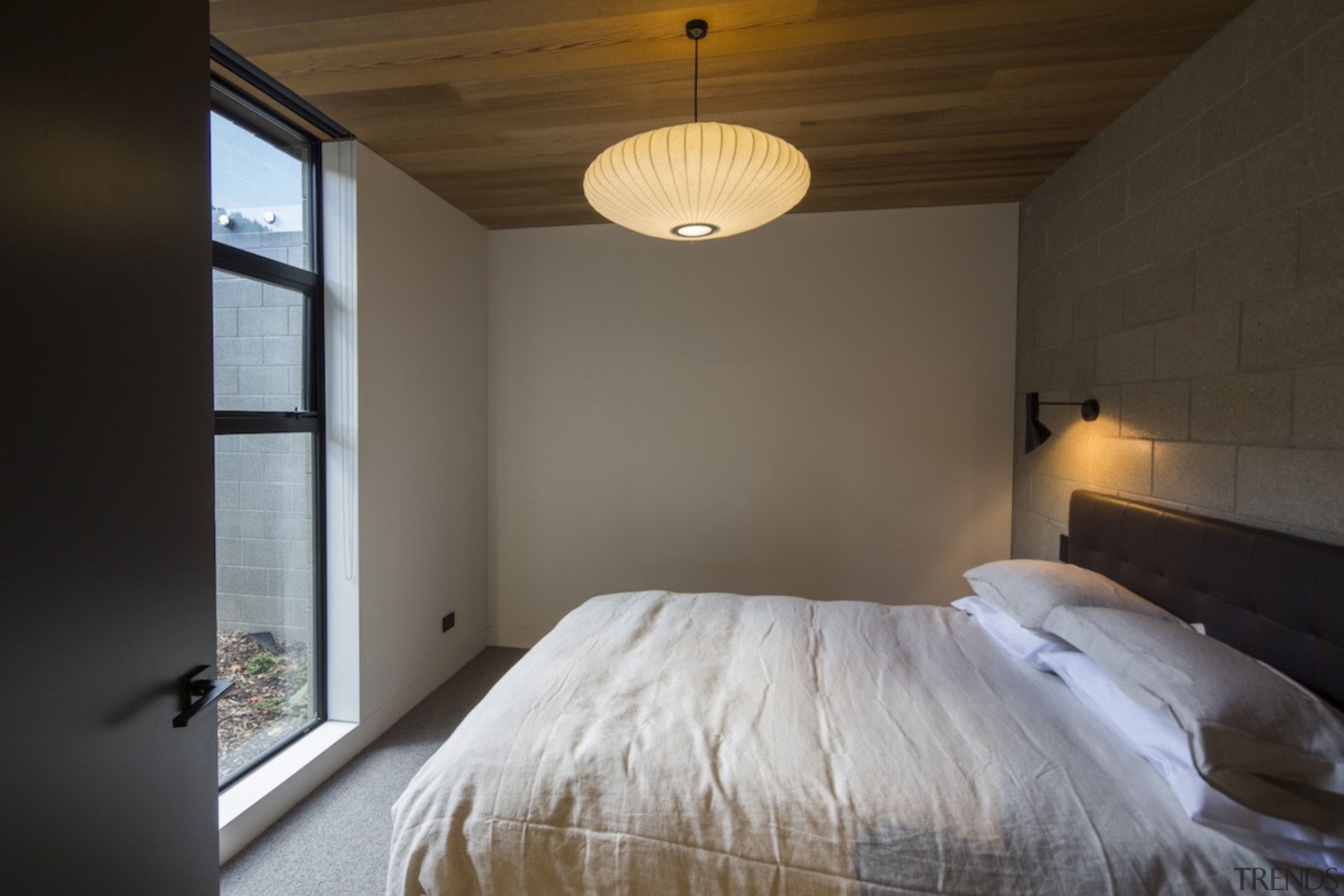 Arrowtown-based Bennie Builders was the only Southern Lakes architecture, bed frame, bedroom, ceiling, daylighting, floor, home, house, interior design, light fixture, lighting, property, real estate, room, wood, black, gray