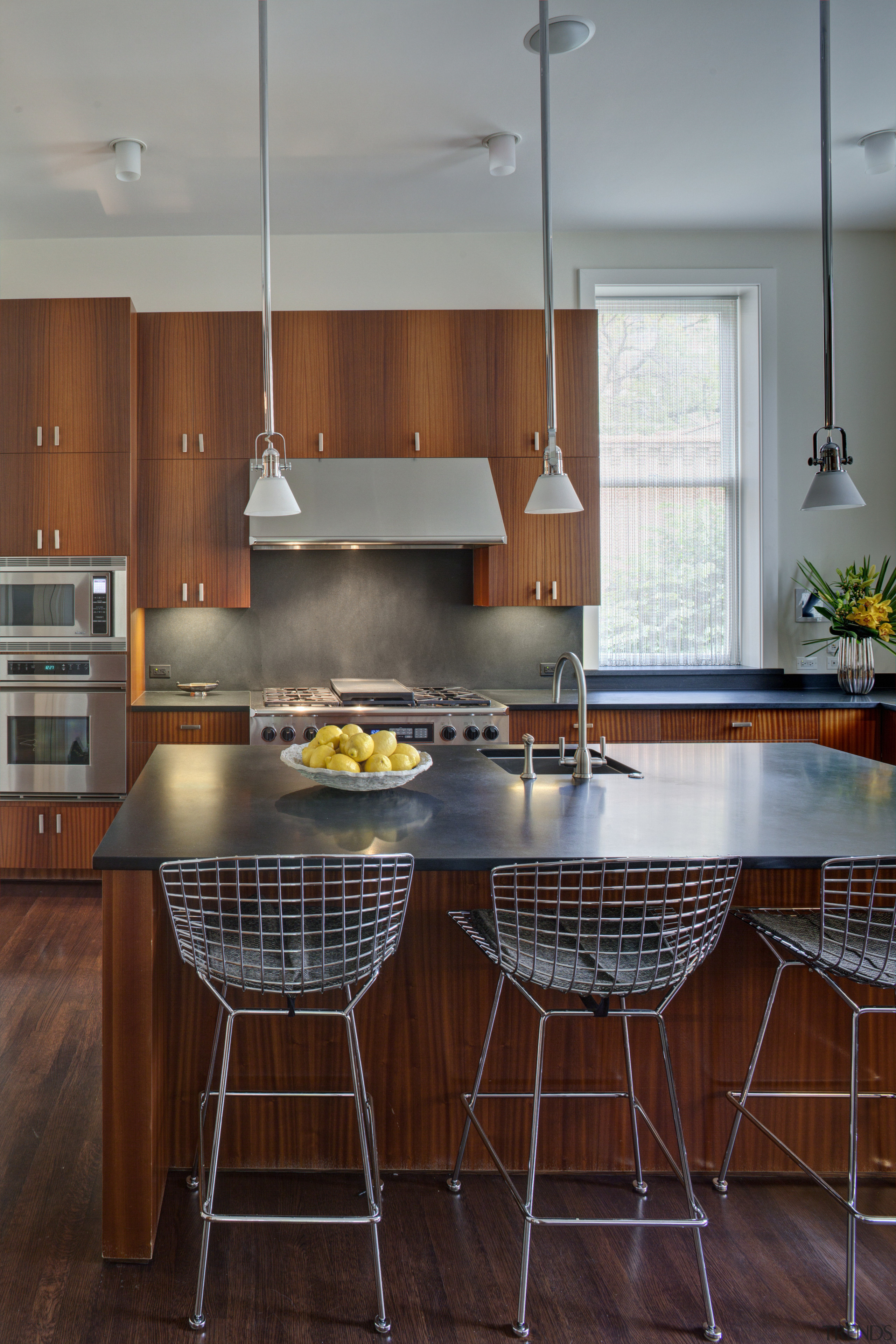 Crisp simplicity defines this contemporary kitchen in an cabinetry, countertop, cuisine classique, flooring, interior design, kitchen, room, table, gray, red