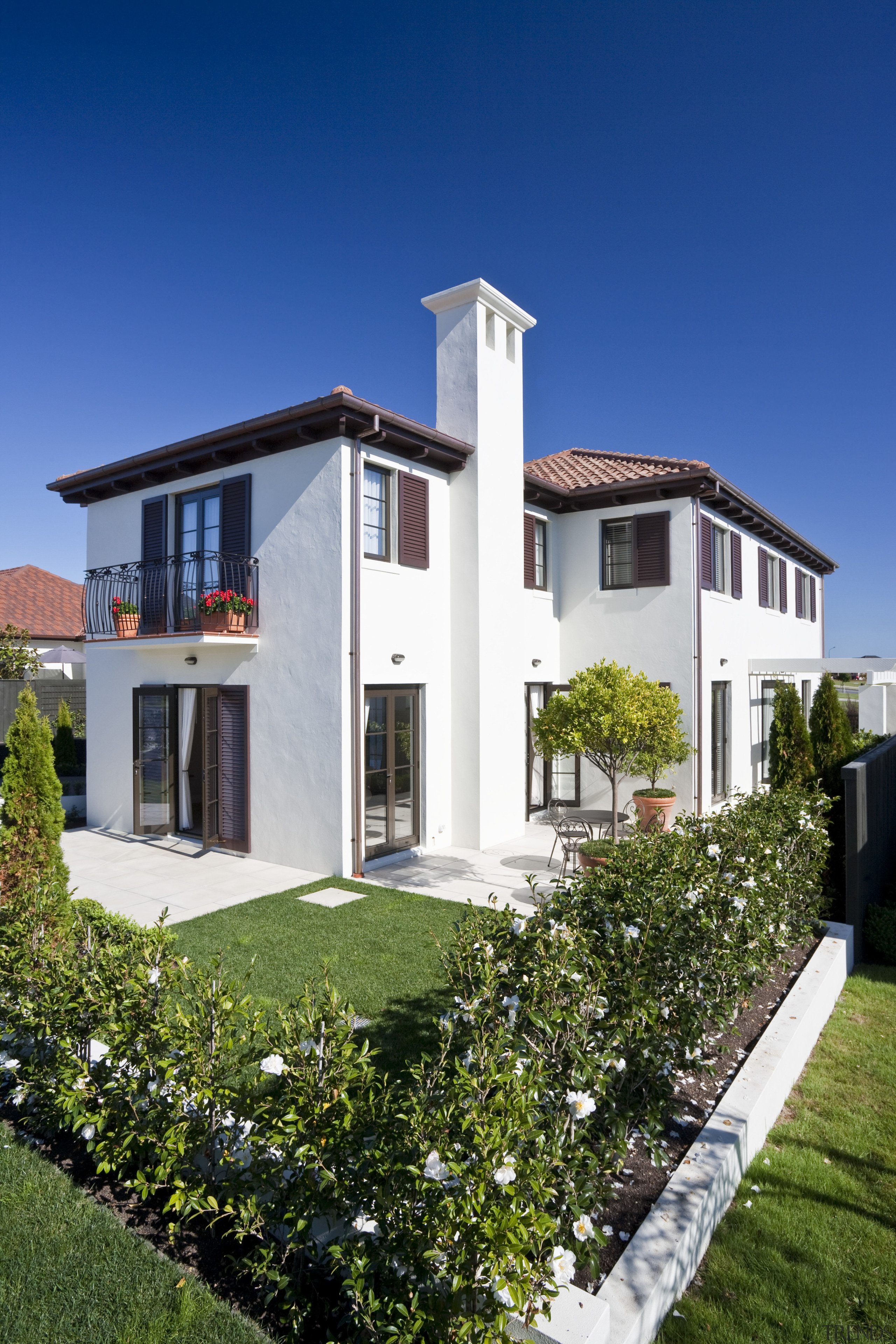 Exterior view of Eden Homes show home which apartment, architecture, building, cottage, elevation, estate, facade, home, house, neighbourhood, property, real estate, residential area, sky, villa, blue