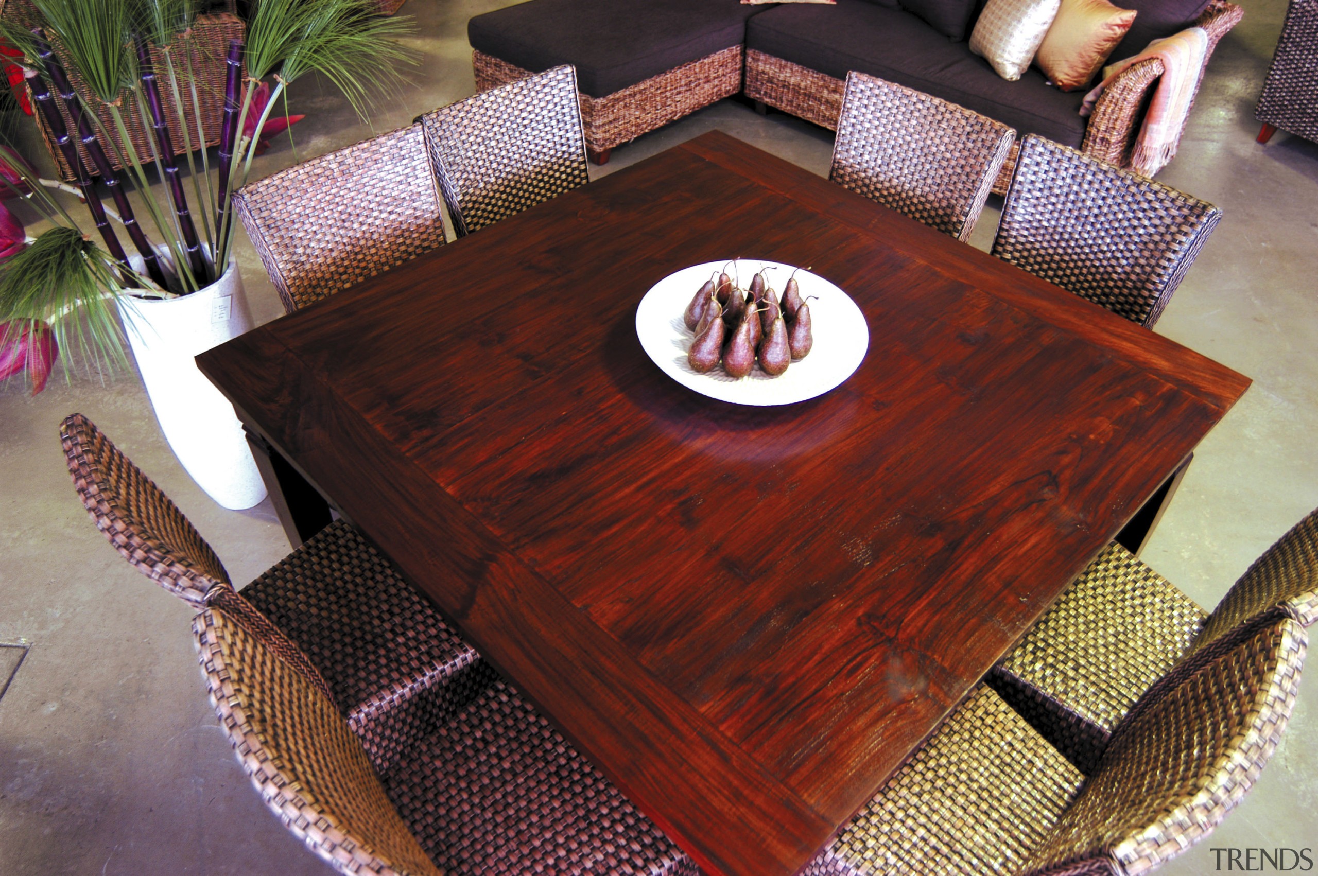 A view of this Samarang furniture that features flooring, furniture, hardwood, table, wood, wood stain, red