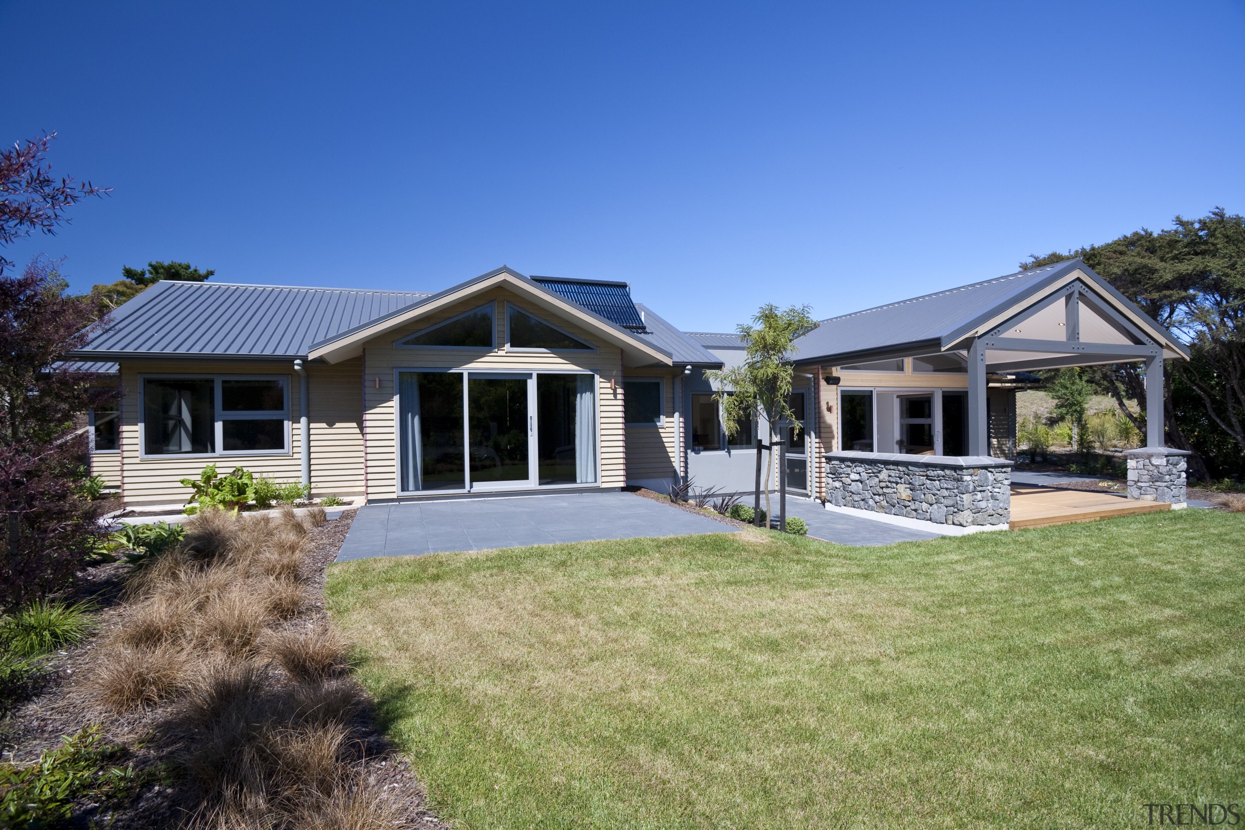 Exterior view of a house built by David backyard, cottage, elevation, estate, facade, farmhouse, home, house, land lot, landscape, property, real estate, residential area, siding, sky, villa, yard