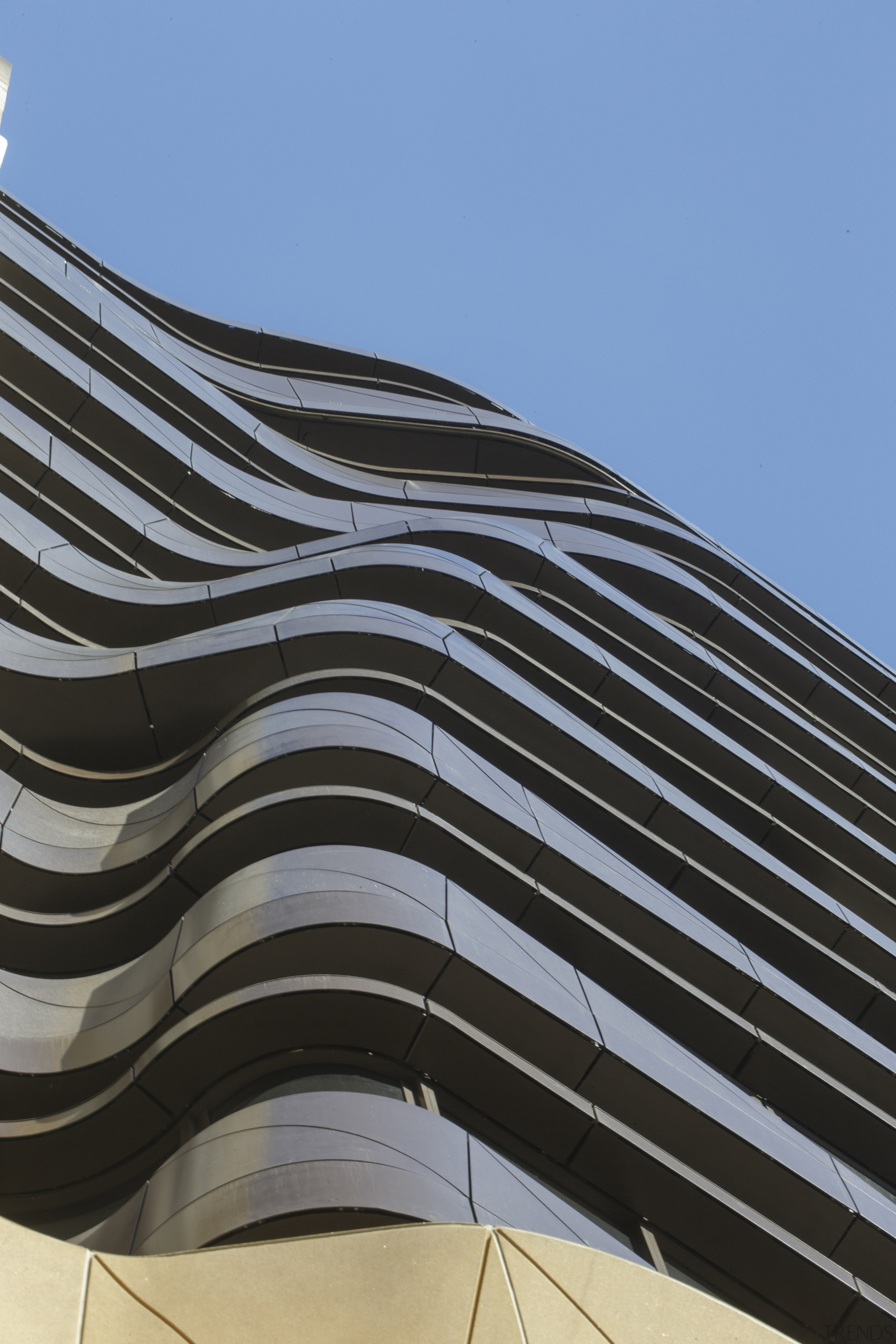The undulating form of the aluminium-clad balconies on angle, architecture, building, daytime, facade, landmark, line, roof, sky, structure, black, teal