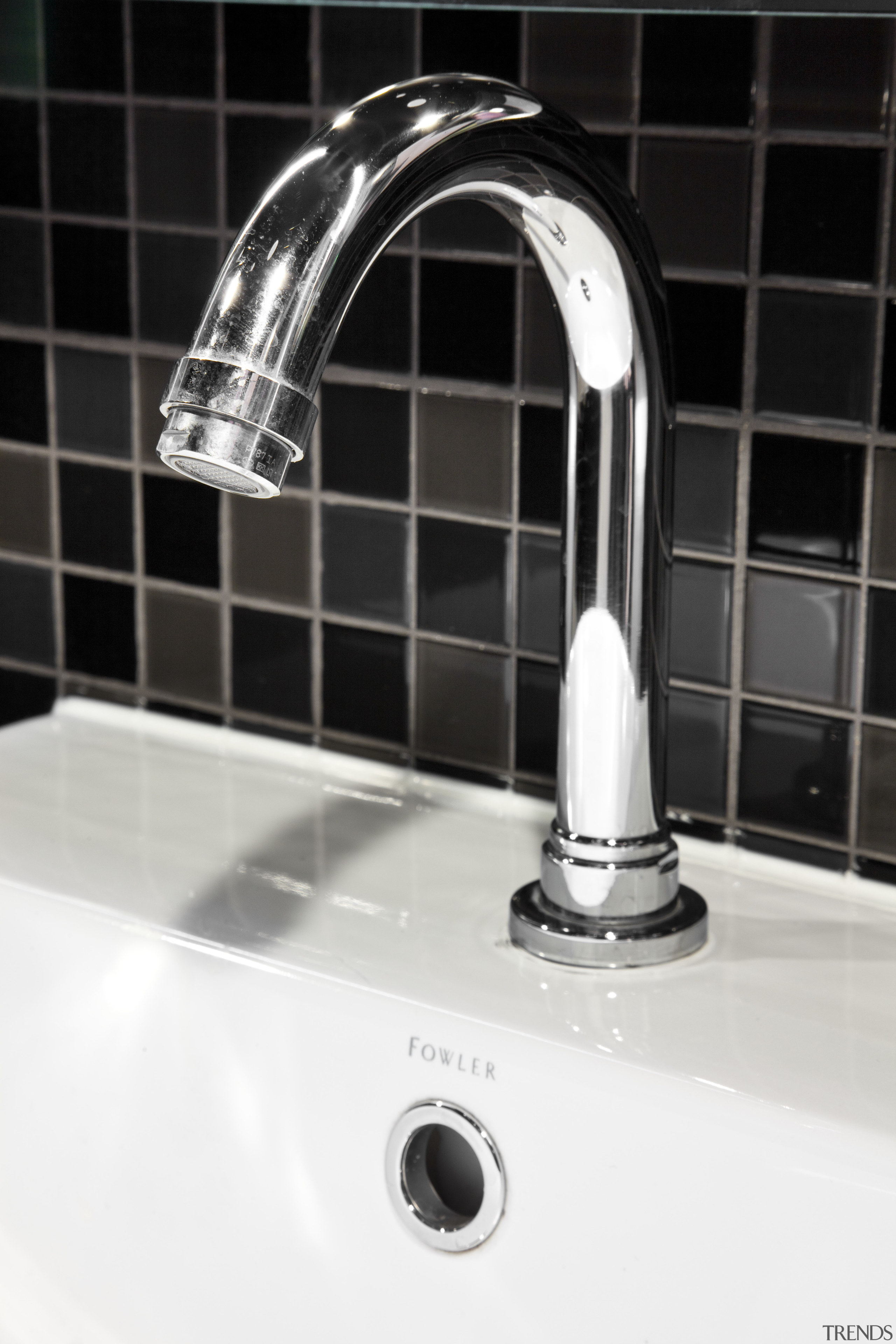 Merquip designed the electronic touch-free tap-ware for this plumbing fixture, product design, sink, tap, black, white