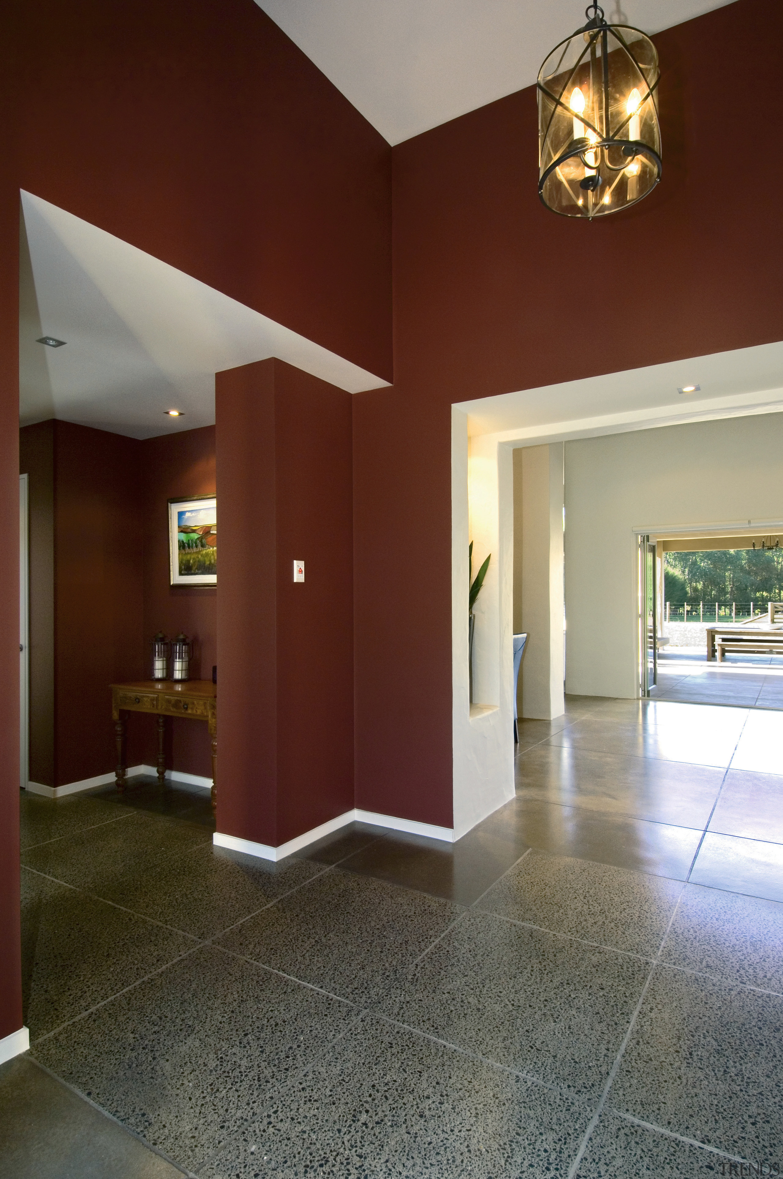 Entrance area of home with brown walls, white apartment, architecture, ceiling, daylighting, estate, floor, flooring, hardwood, home, house, interior design, living room, lobby, property, real estate, room, wall, window, wood, wood flooring, red, gray