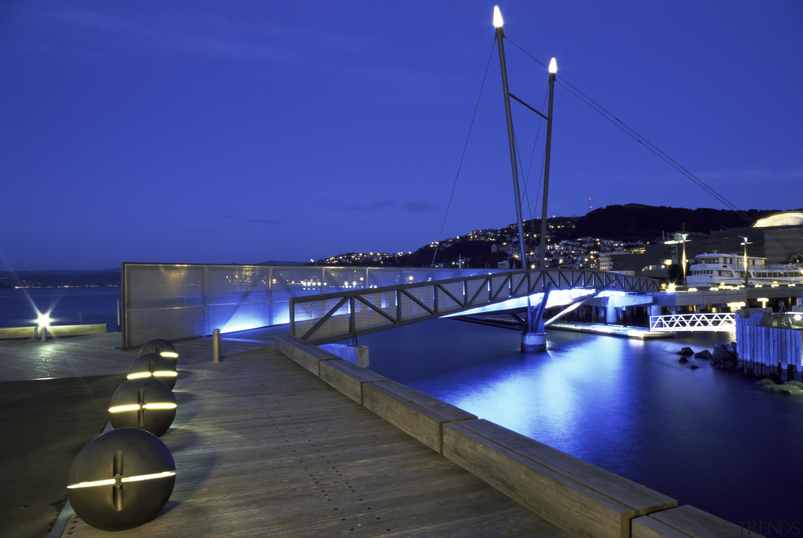 This design, called Wellington Waterfront Promenade, received and dock, evening, lighting, marina, night, resort, sea, sky, swimming pool, water, blue