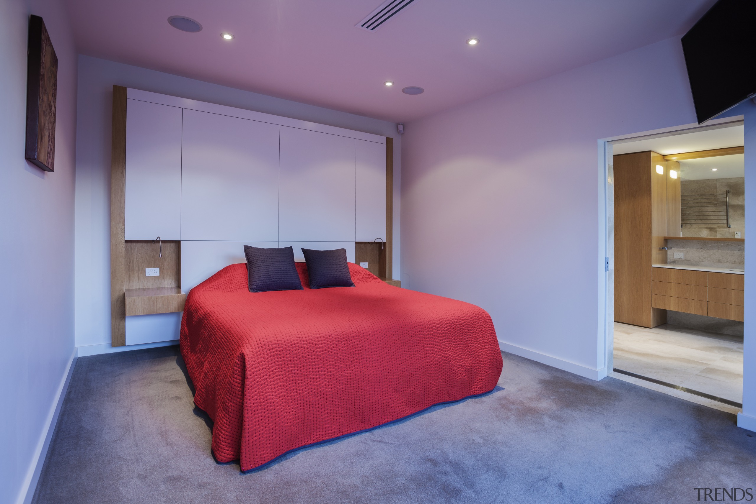 A new sandstone-clad form frames the entry to architecture, bedroom, ceiling, estate, floor, home, house, interior design, property, real estate, room, suite, wall, purple