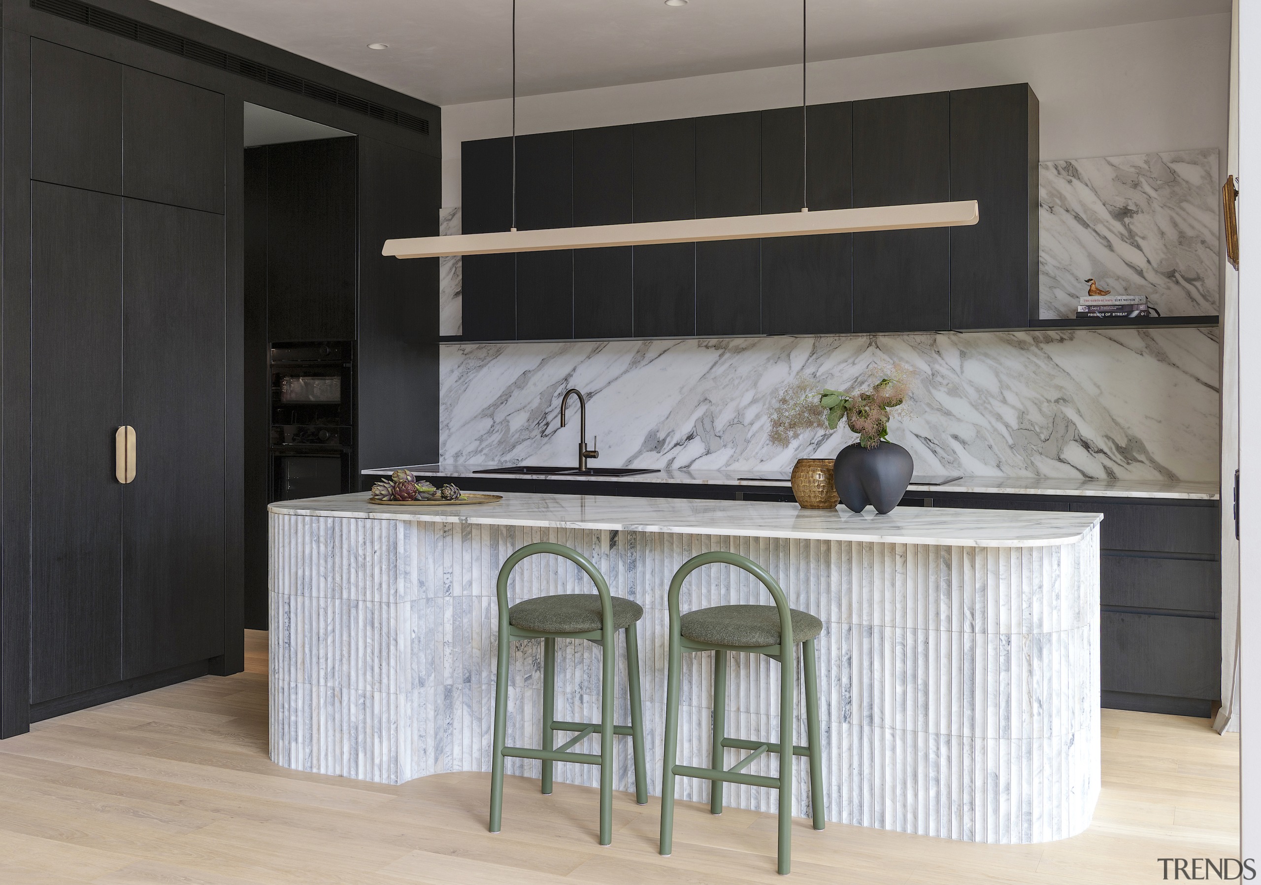The dark, minimalist joinery lets the noble stonework 