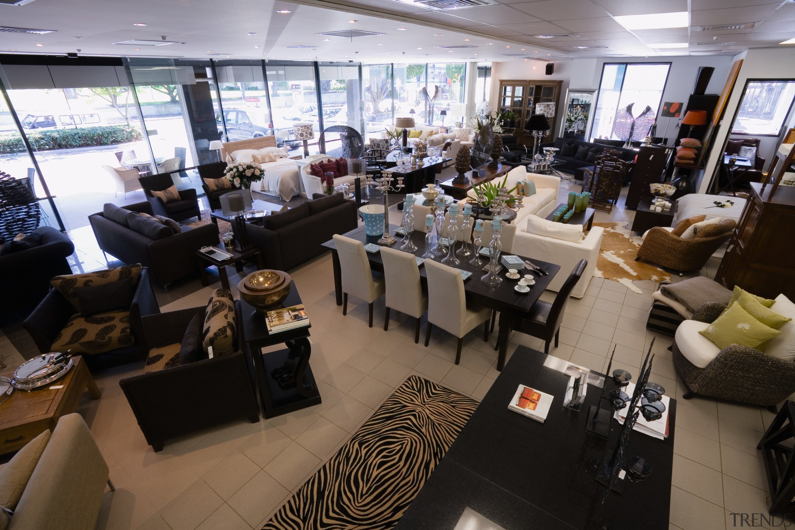 View of showroom with mix of furniture settings restaurant, black