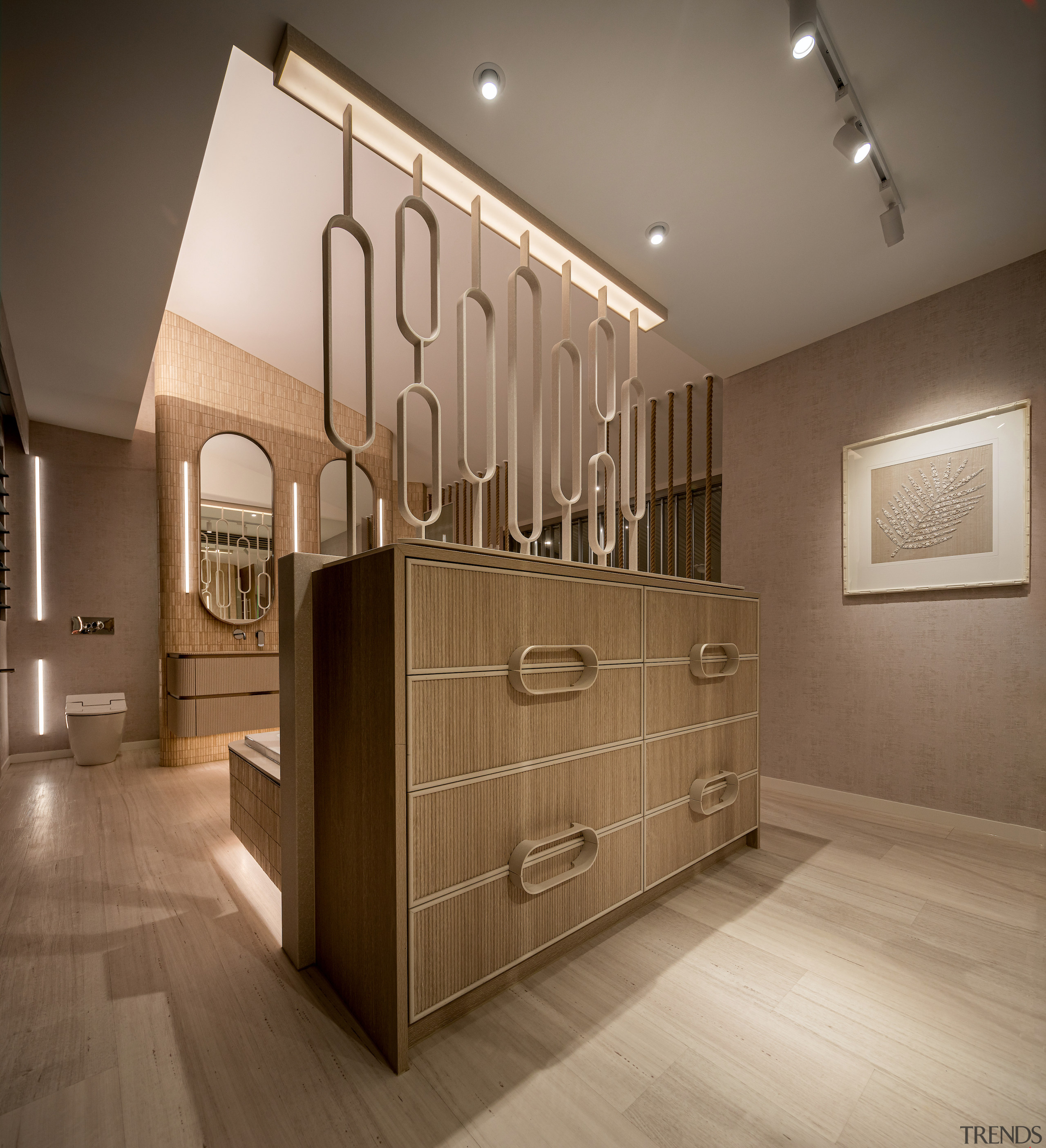 Cabinetry handles echo the dividing grille pattern above. 