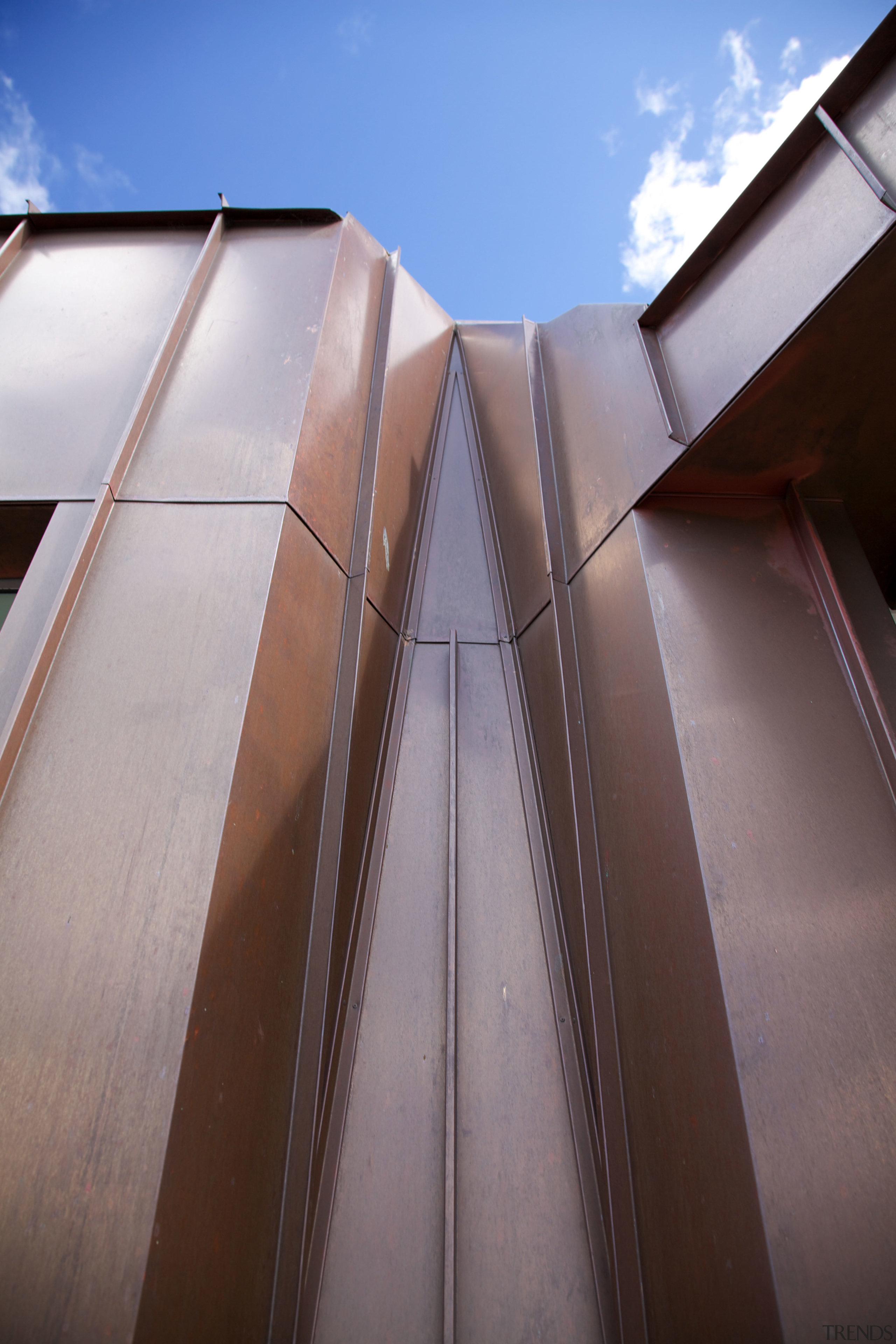 A copper cloak drapes and folds down this angle, architecture, building, daylighting, daytime, facade, line, sky, structure, gray