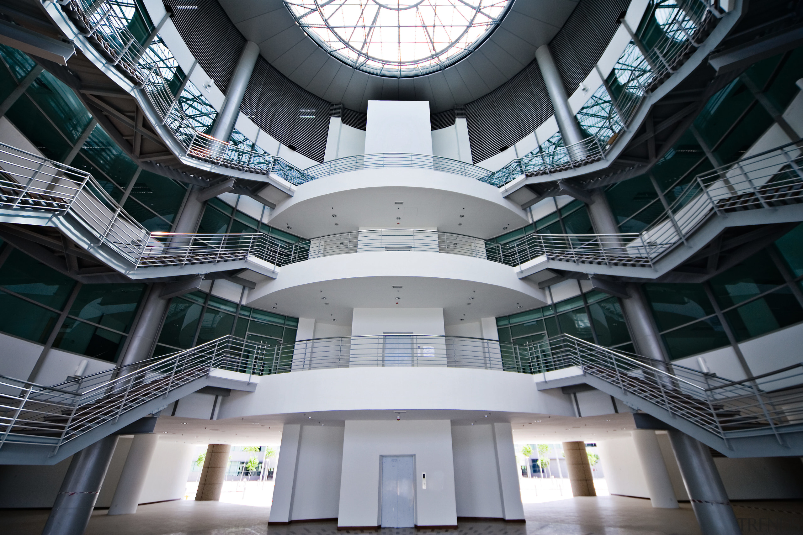 view of the central antrium featuring huge skylight architecture, building, daylighting, facade, metropolis, metropolitan area, structure, symmetry, black, gray