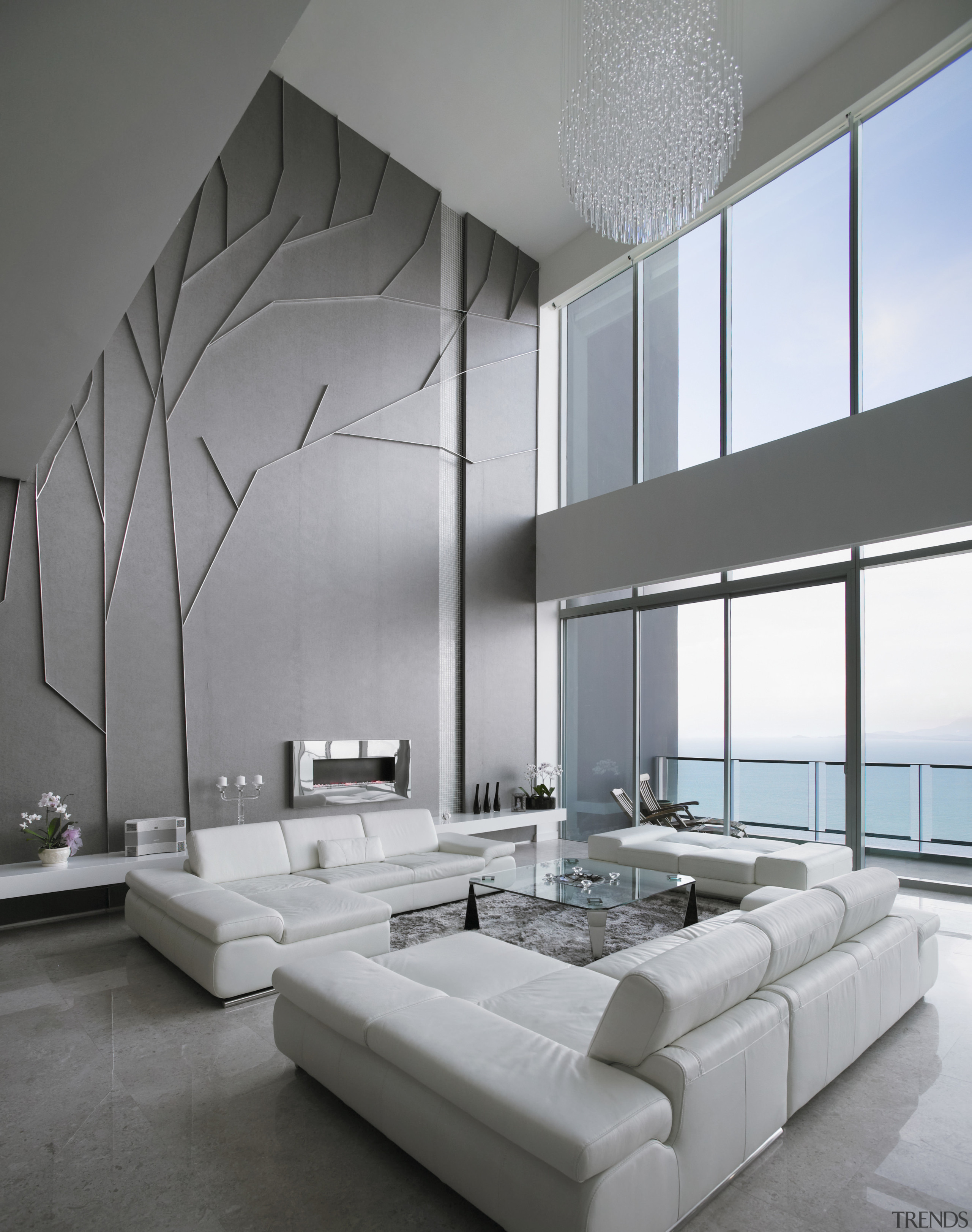 View of apartment living area at Springtide Residences architecture, bed frame, ceiling, daylighting, floor, furniture, interior design, living room, product design, table, wall, gray