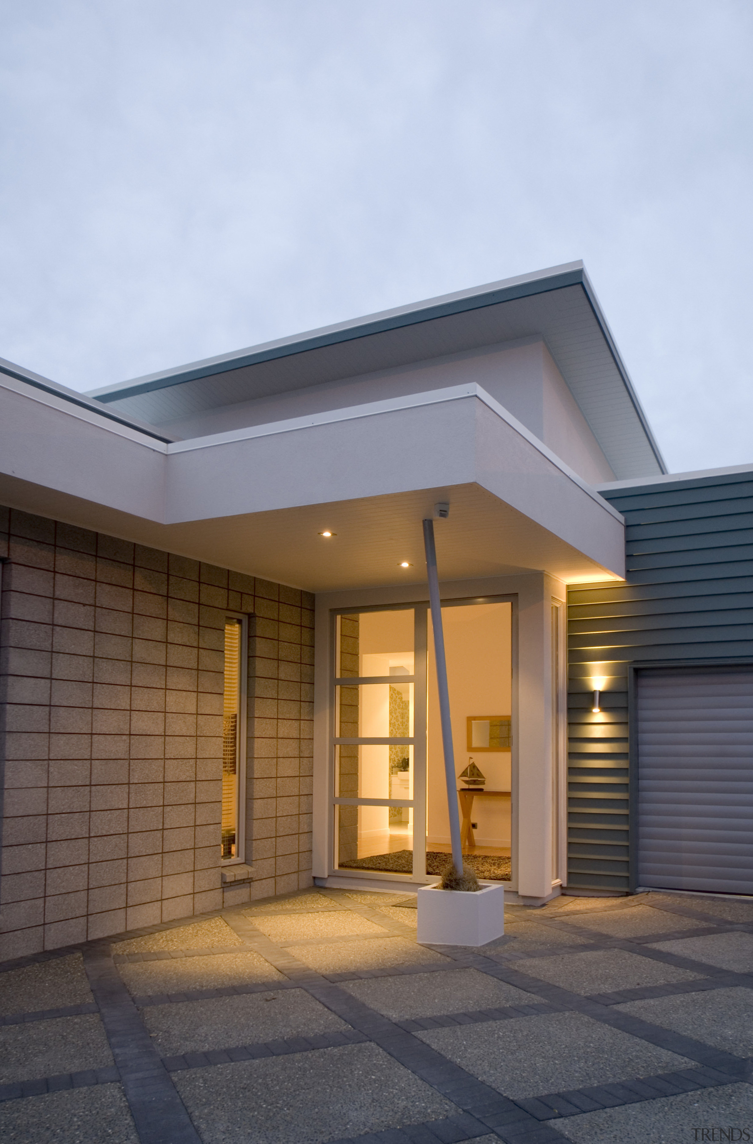 A fully glazed front door, exposed honedblock and architecture, building, daylighting, elevation, facade, home, house, real estate, residential area, roof, siding, window, teal