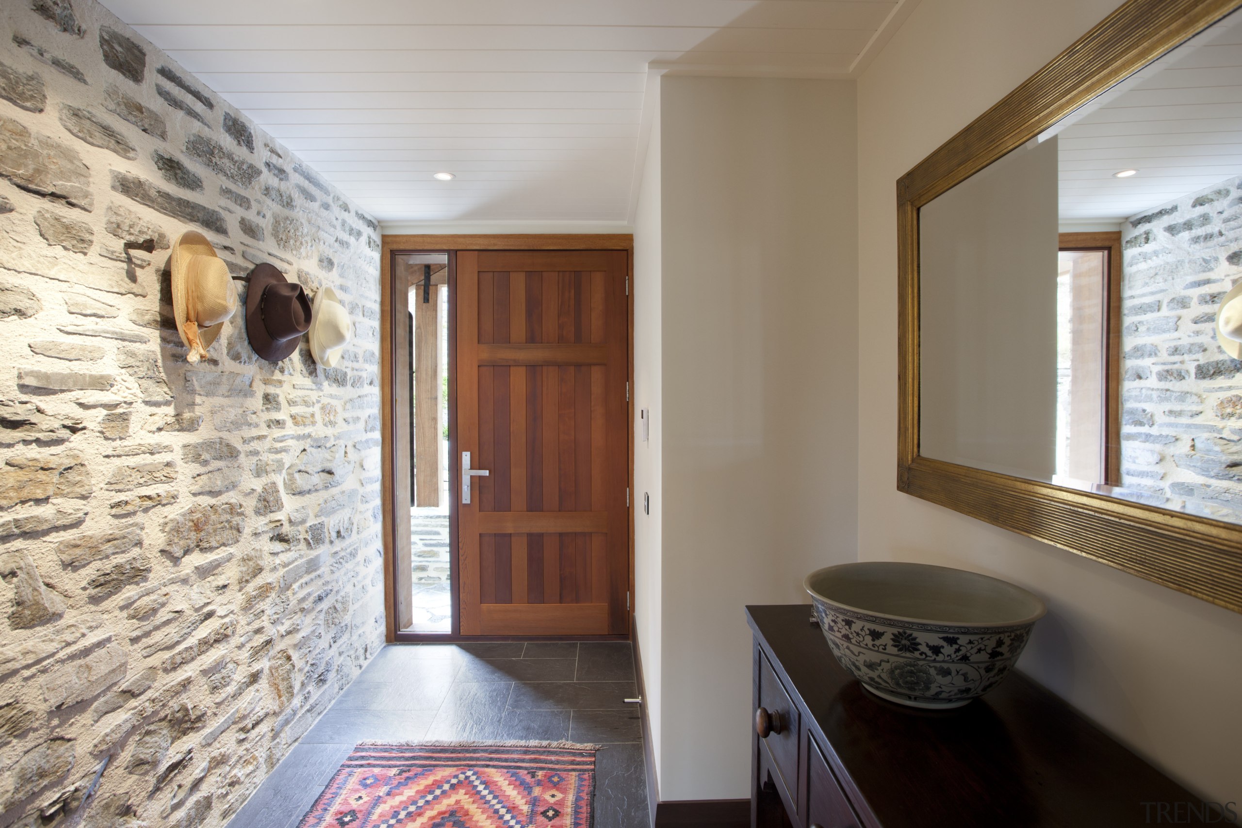 View of entrance with stone wall, woodem door ceiling, estate, floor, flooring, home, interior design, property, real estate, room, wall, window, wood, gray, brown