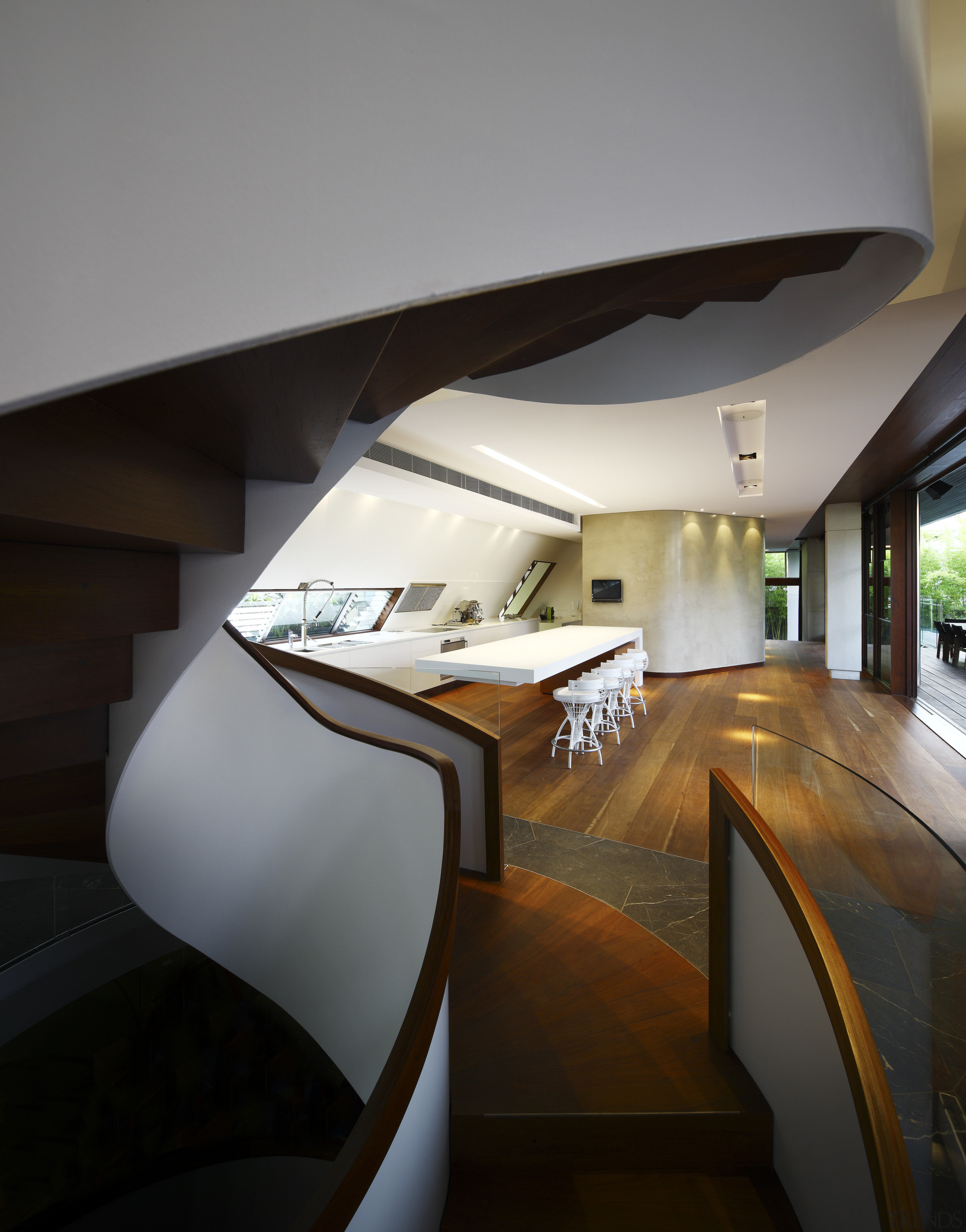 View of spiral staircase and kitchen area featuring architecture, daylighting, furniture, house, interior design, product design, stairs, table, black, gray