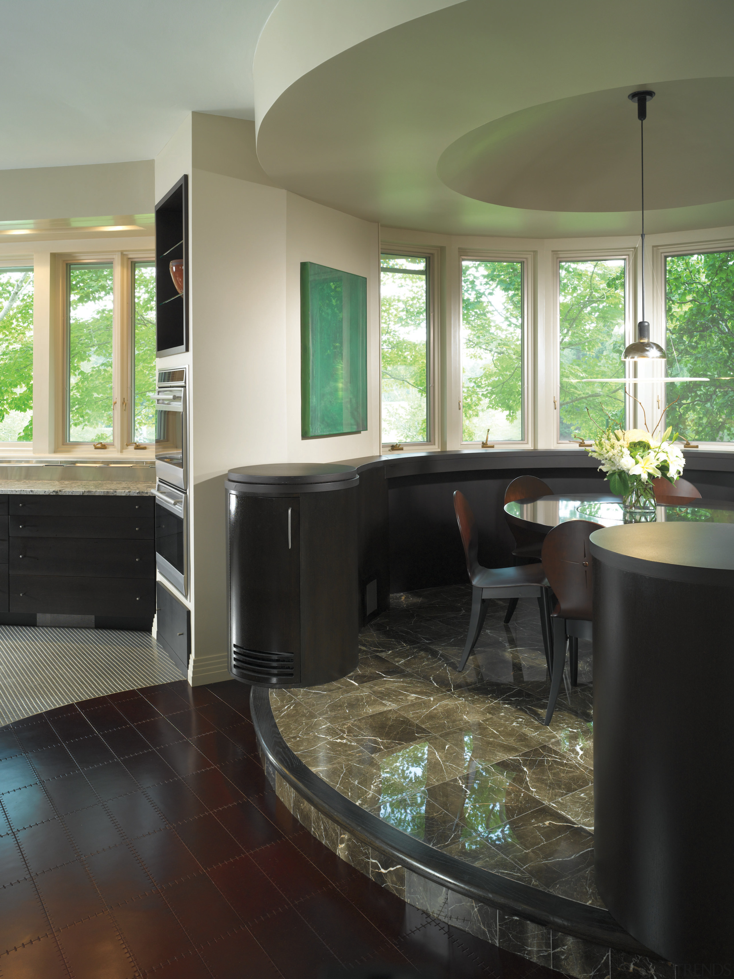 A view of the dining area, tiled floor, cabinetry, countertop, floor, flooring, home, interior design, kitchen, living room, room, window, wood flooring, black, brown