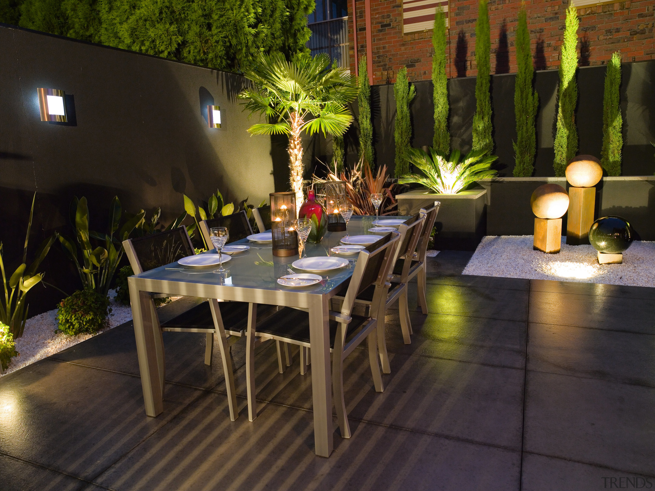 view of the outdoor dining area featuring alluminium flower, furniture, lighting, outdoor structure, patio, plant, table, black, brown