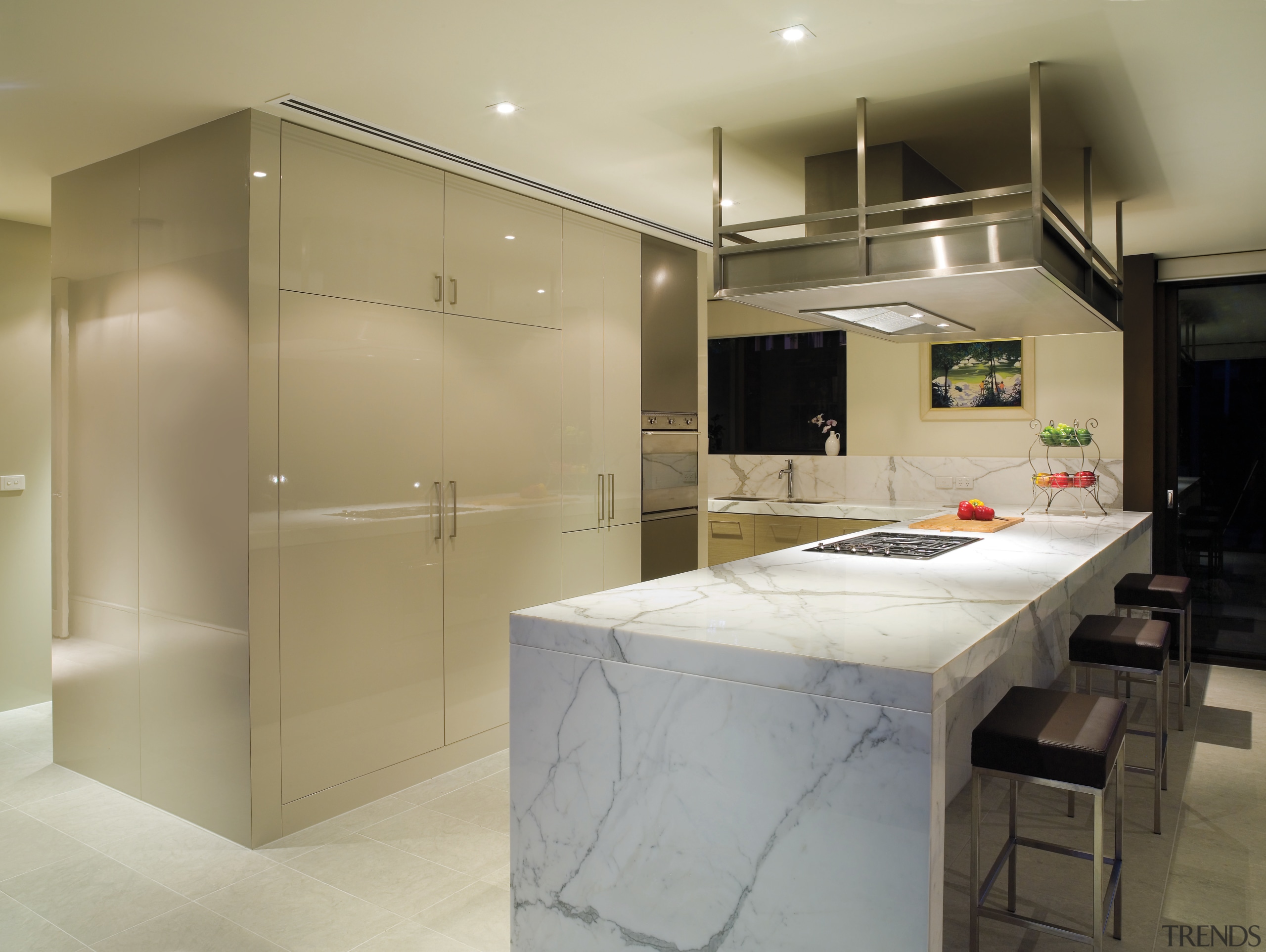 A view of this kitchen featuring clalcutta marble cabinetry, countertop, interior design, kitchen, real estate, room, orange, brown