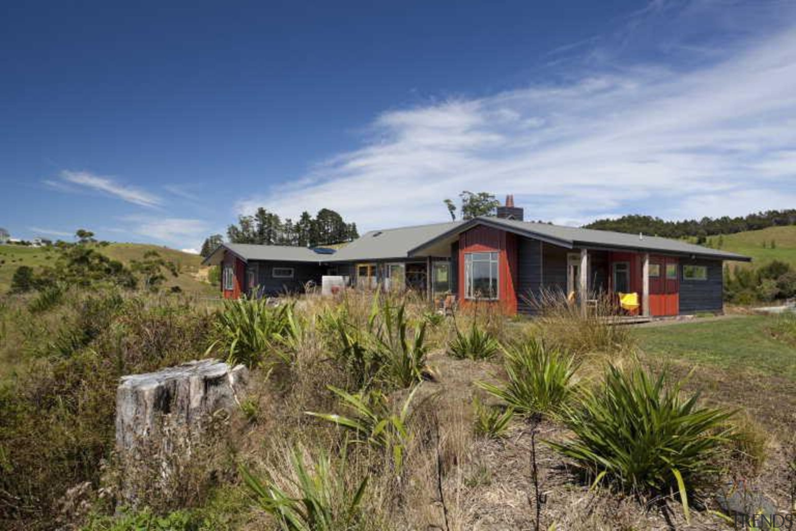 View of exterior from a distance - Exterior cottage, estate, home, house, land lot, landscape, plant community, property, real estate, shrubland, sky, brown