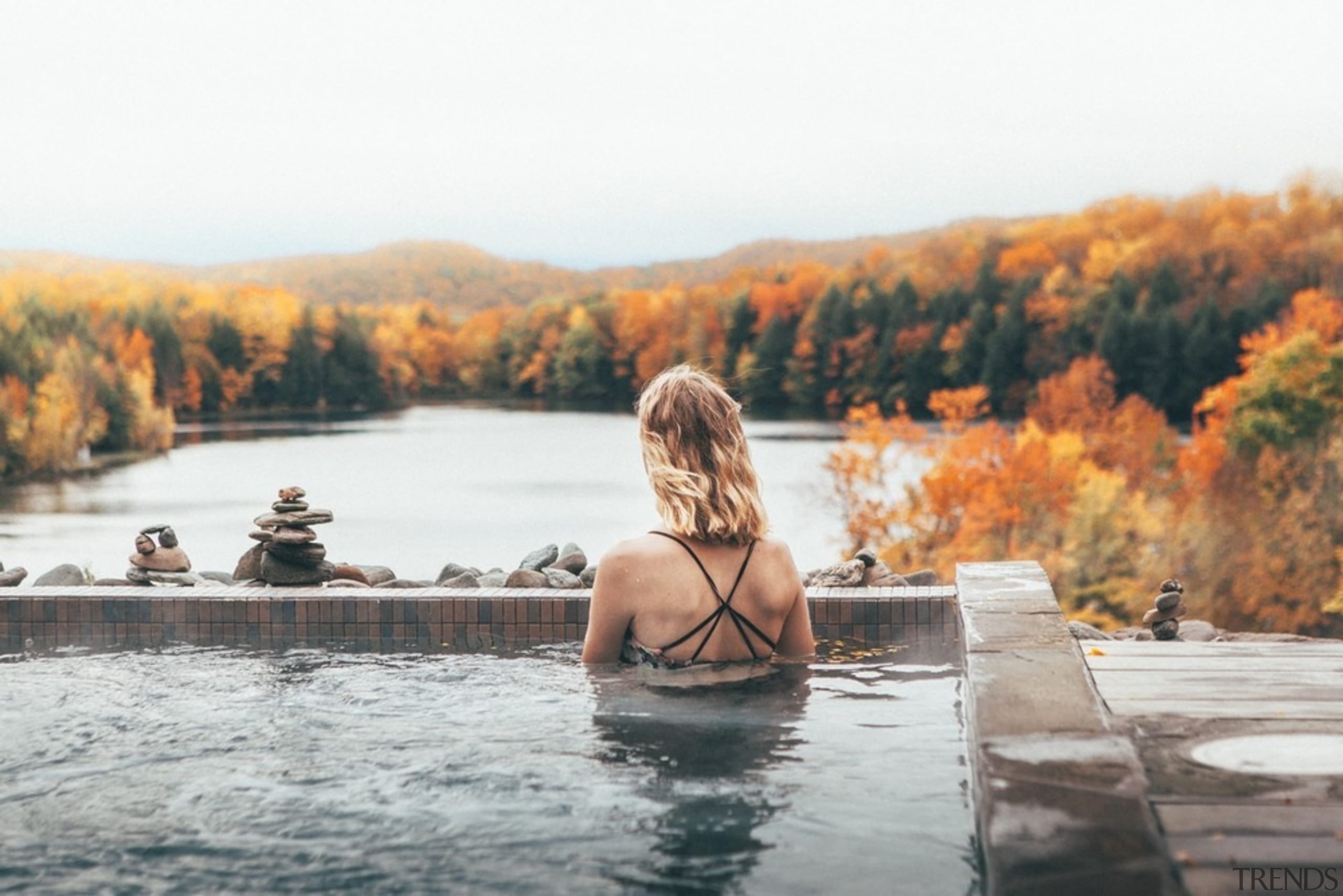 The surface of the water blends into the autumn, fountain, lake, leaf, leisure, photography, reflection, river, sky, summer, sunlight, tree, vacation, water, water feature, white