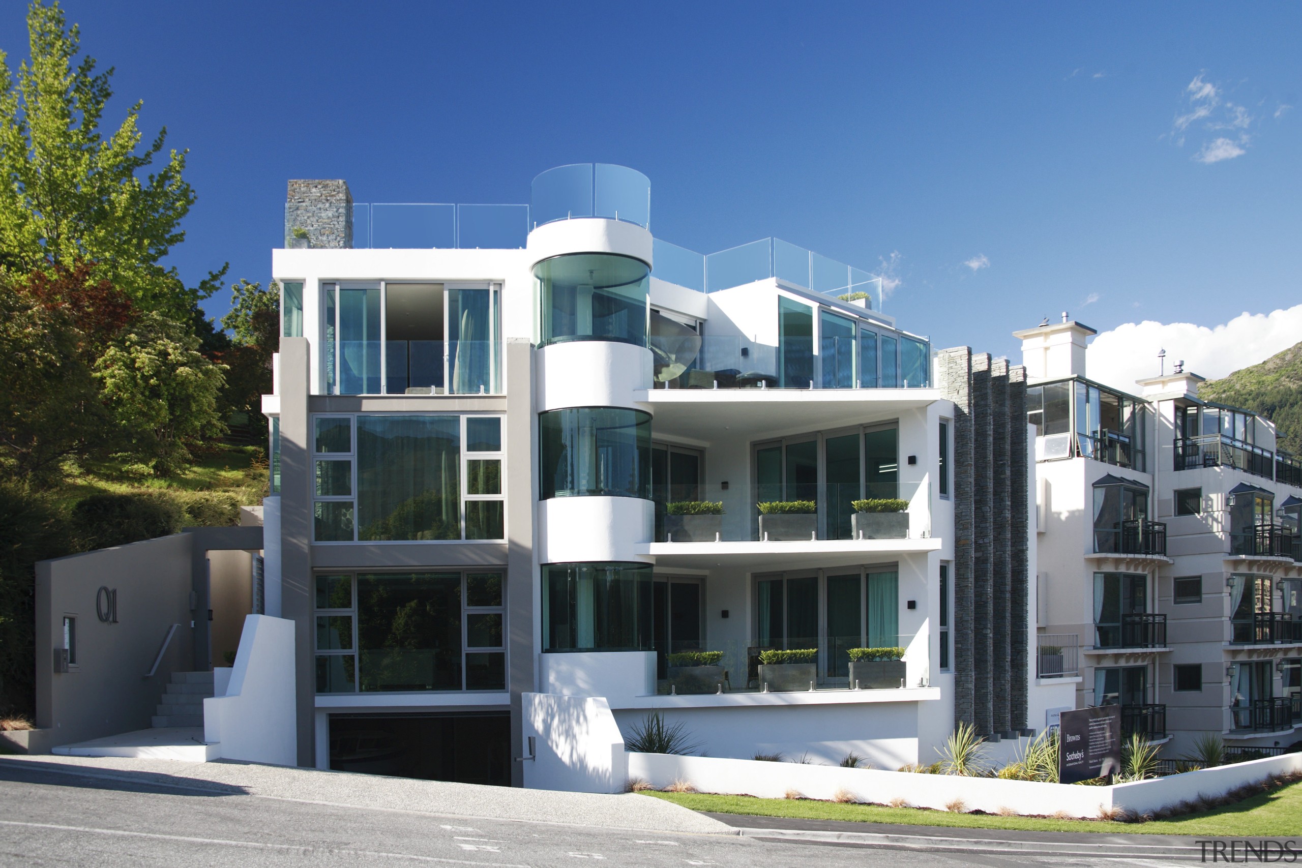 Exterior view of an apartment building which features apartment, architecture, building, commercial building, condominium, corporate headquarters, elevation, estate, facade, home, house, mixed use, neighbourhood, property, real estate, residential area