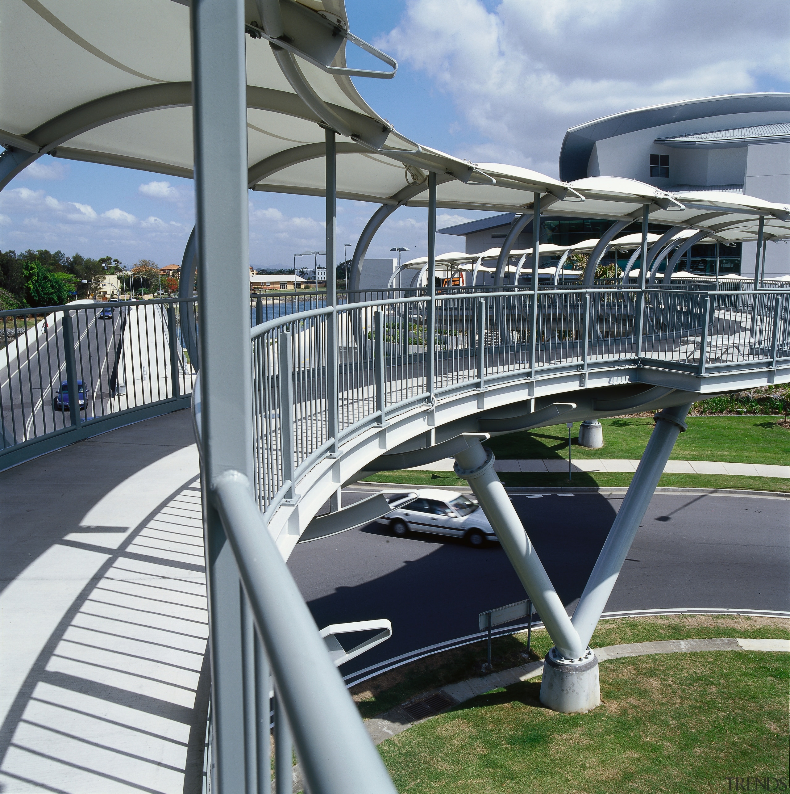 Curved pedestrian bridge walkway with steel structure and bridge, fixed link, structure, water, gray