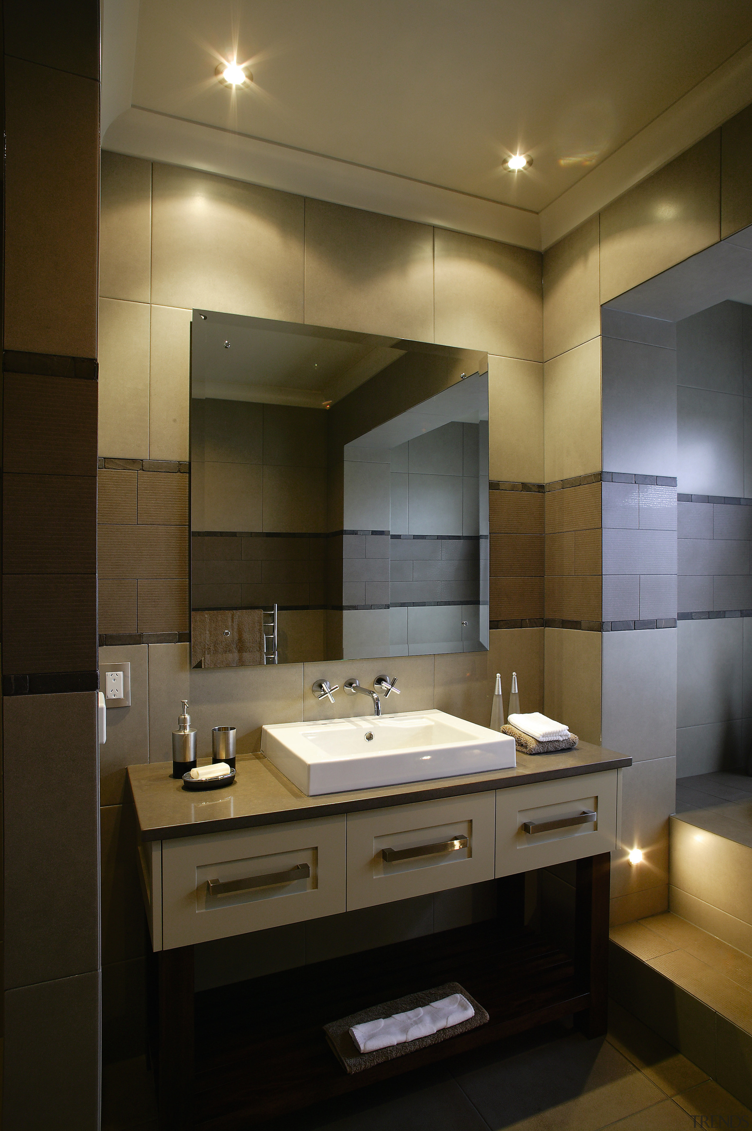 A view of the bathroom featuriing underfloor heating, architecture, bathroom, ceiling, countertop, interior design, lighting, room, sink, brown