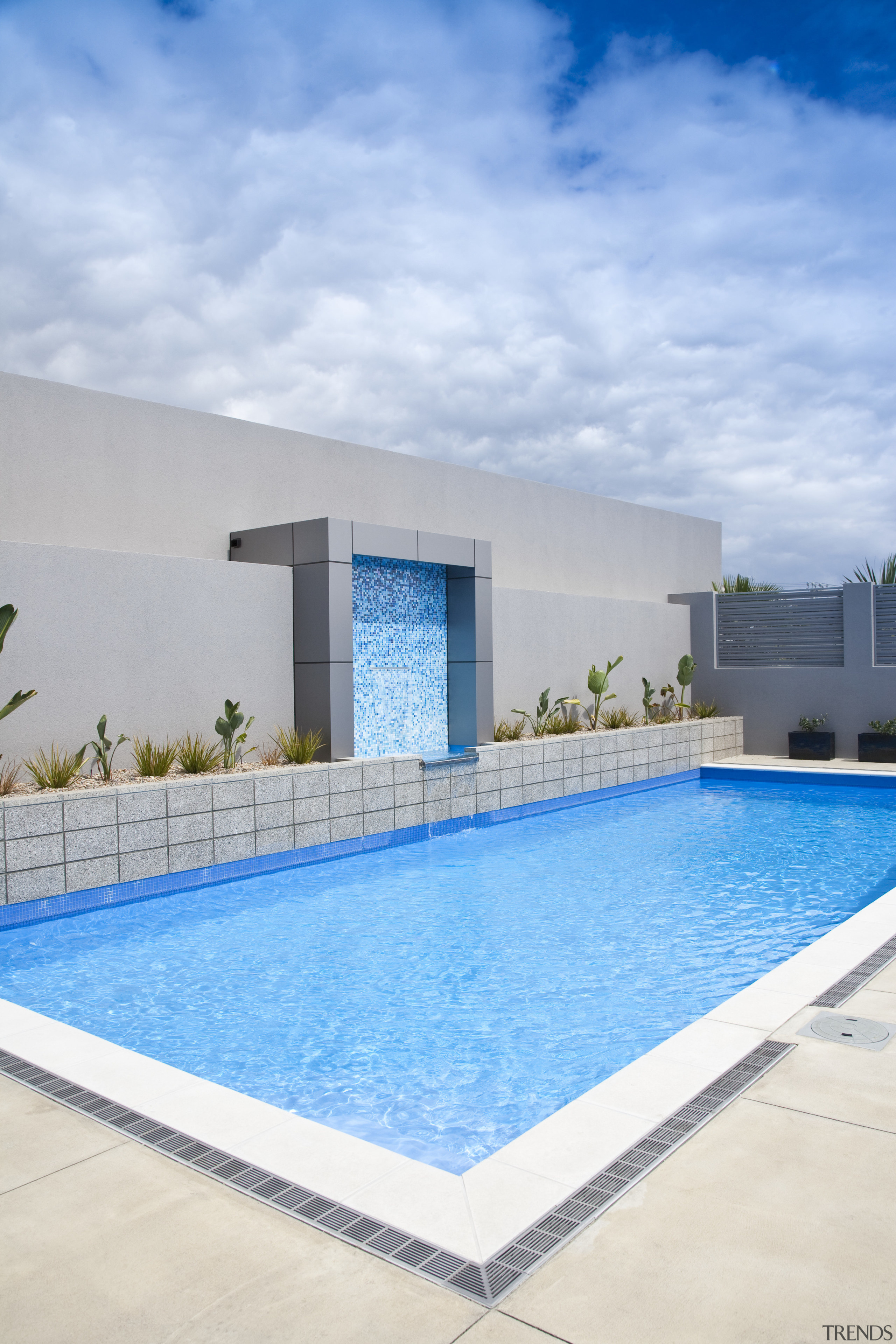 View of a paved pool area which features architecture, condominium, estate, home, house, leisure, property, real estate, sky, swimming pool, villa, water, teal, gray