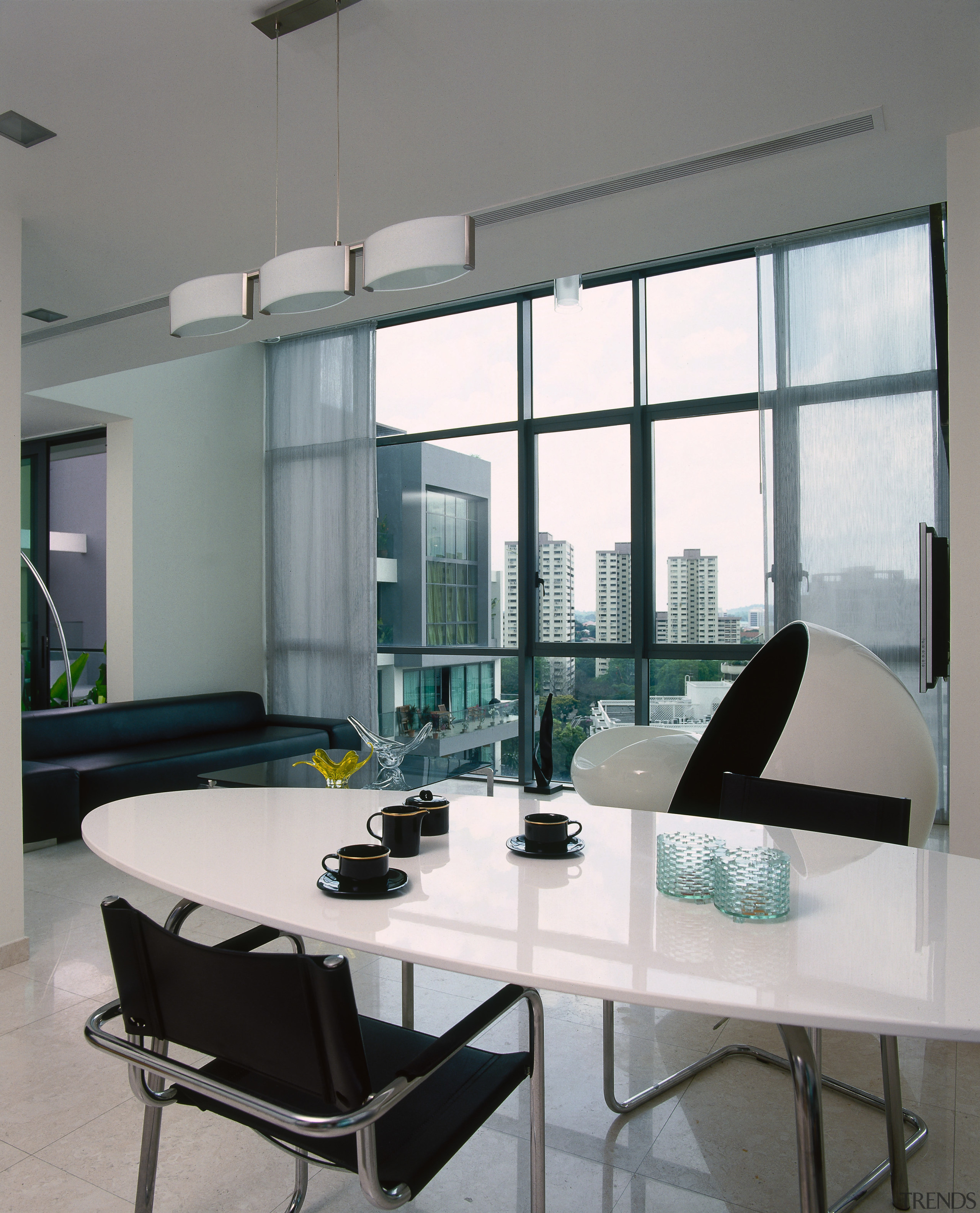 Aview of the dining area, tiled flooring, white furniture, glass, interior design, living room, table, window, gray