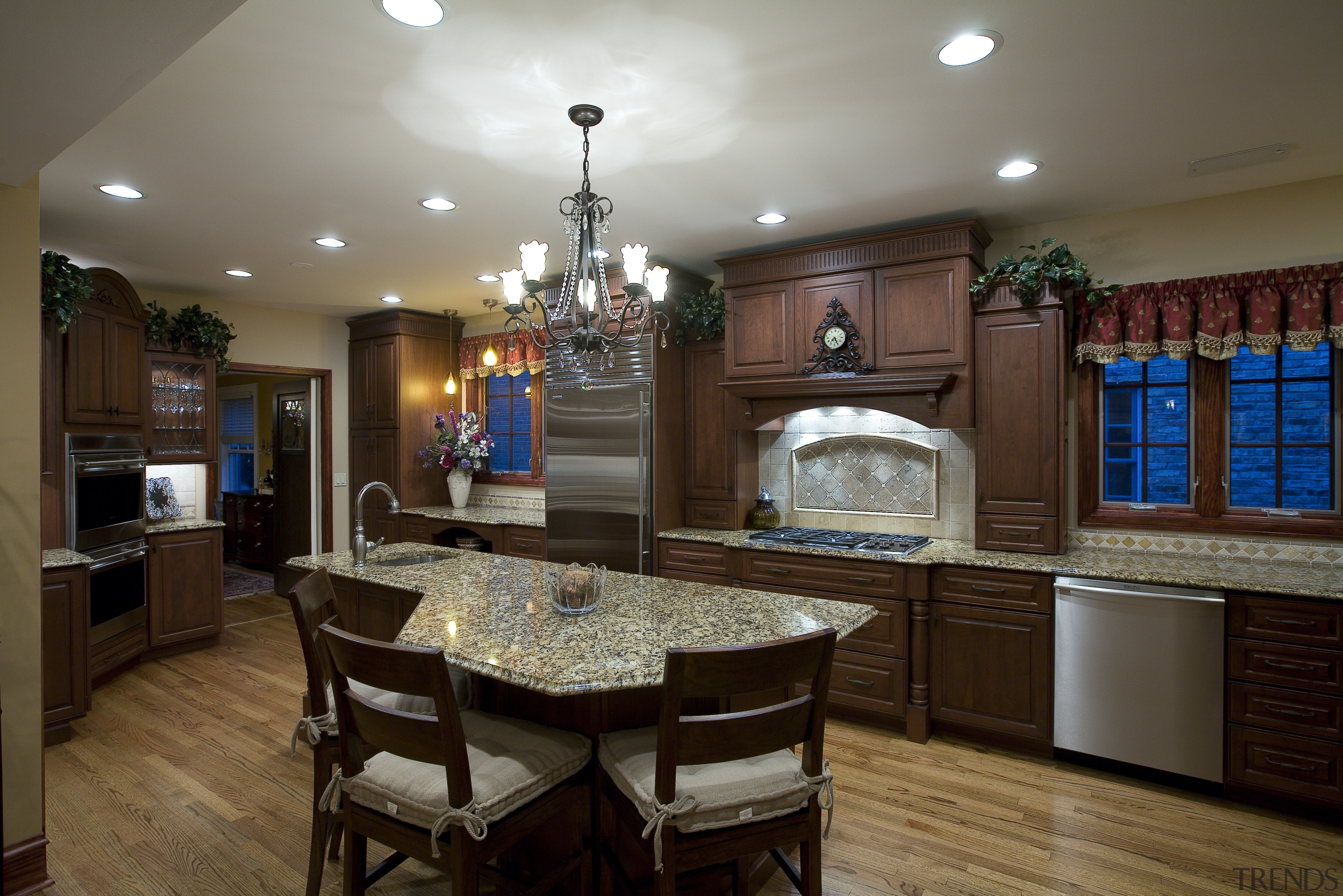 A view of this remodelled kitchen designed by cabinetry, countertop, cuisine classique, dining room, hardwood, home, interior design, kitchen, room, brown, gray