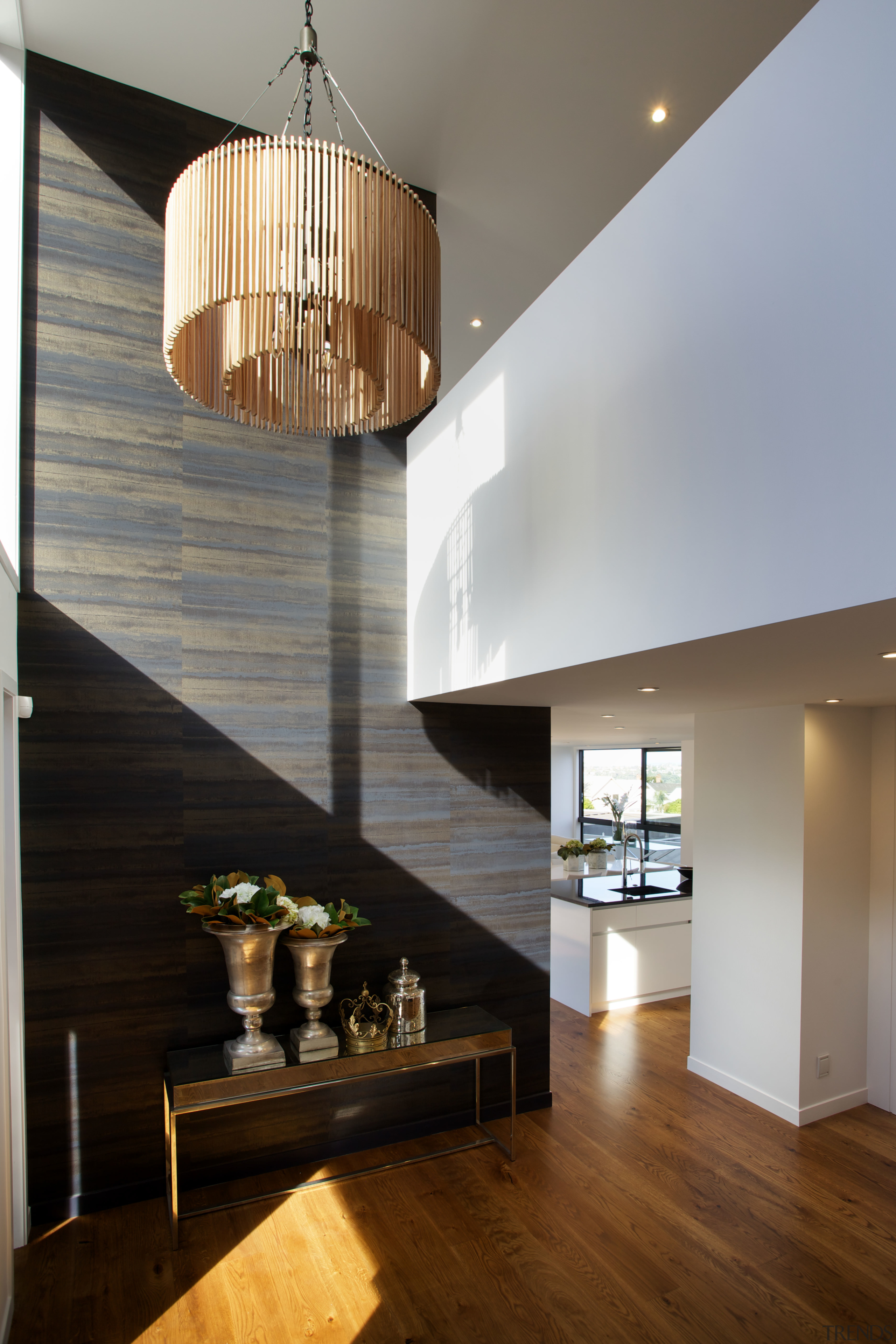 Entry to contemporary Parnell townhouse designed by Paul apartment, architecture, ceiling, daylighting, dining room, floor, hardwood, home, house, interior design, light fixture, lighting, living room, lobby, loft, gray