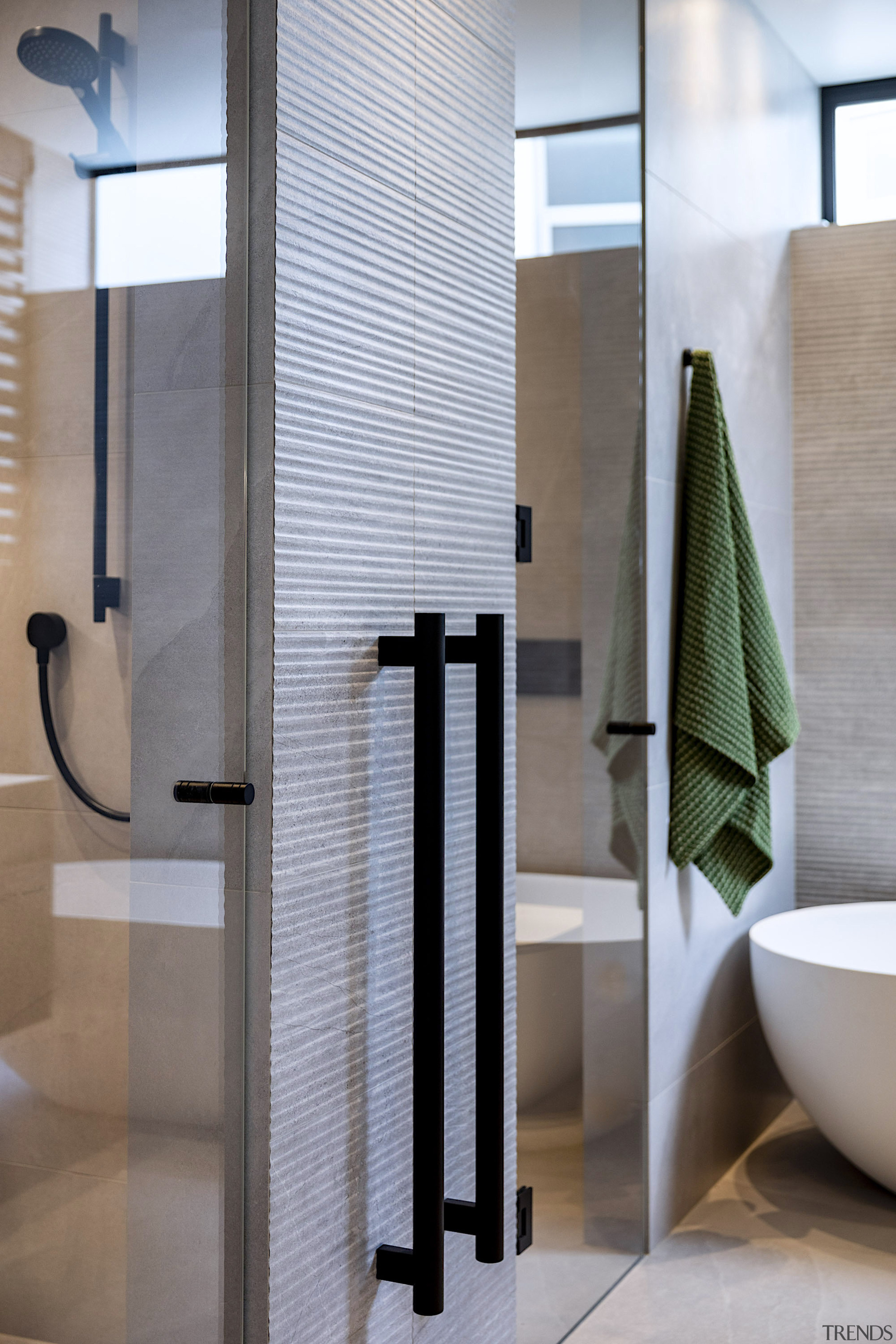 Contemporary towel rails contribute to the bathroom design's 