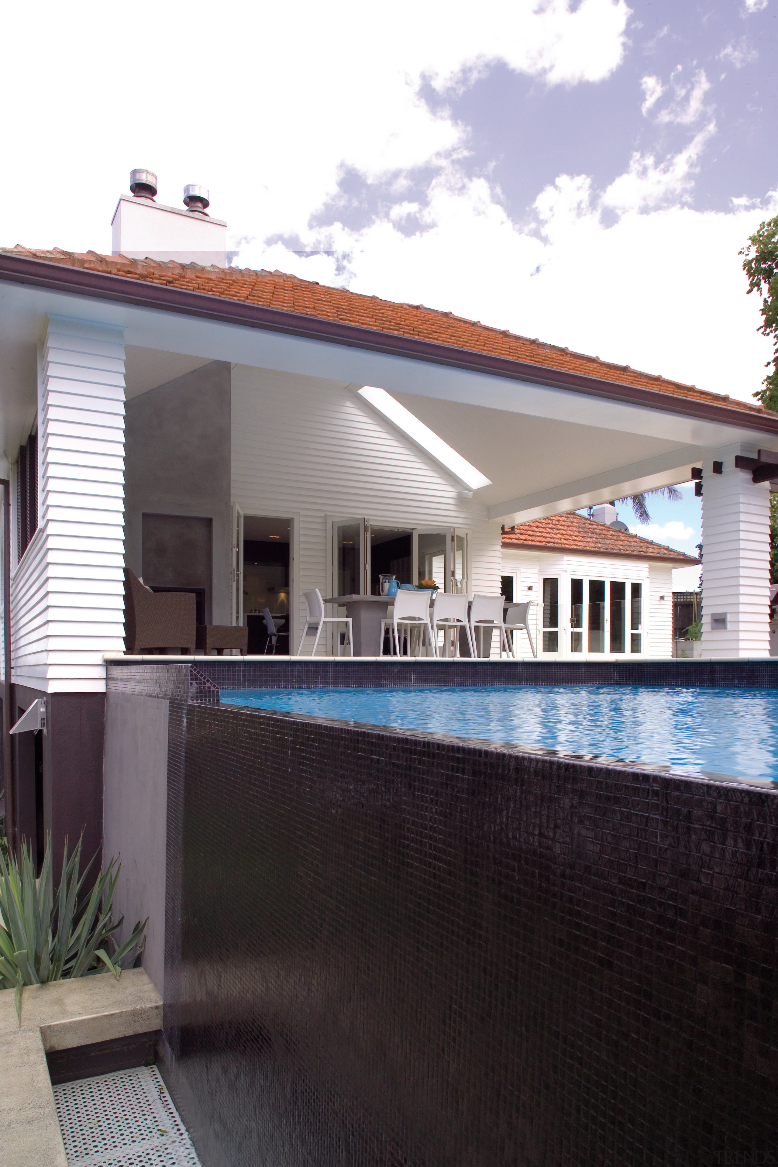 A view of the outdoor undercover entertaining area architecture, building, estate, facade, home, house, property, real estate, residential area, roof, siding, villa, window, black, white, gray