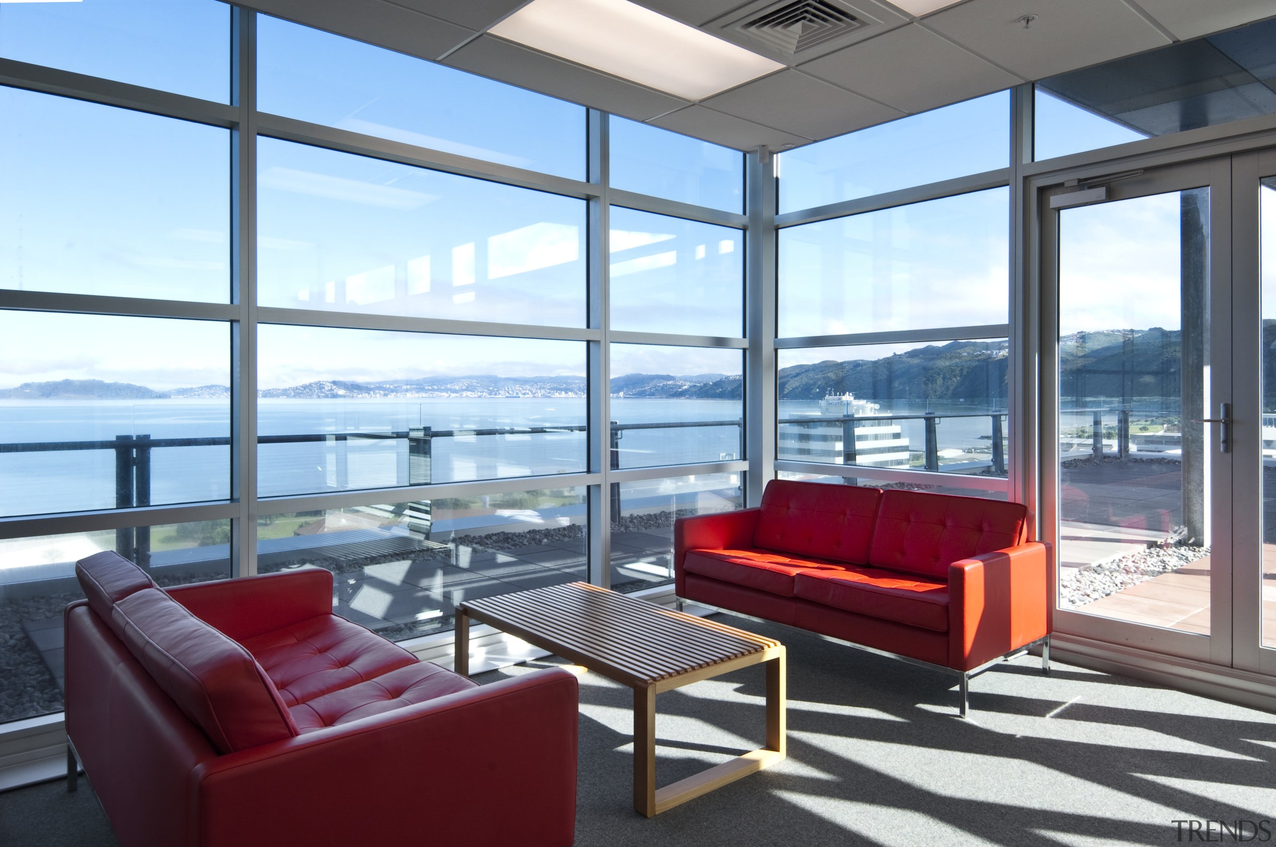 Interior view of seating area at the the apartment, architecture, condominium, daylighting, house, interior design, living room, penthouse apartment, property, real estate, window, teal