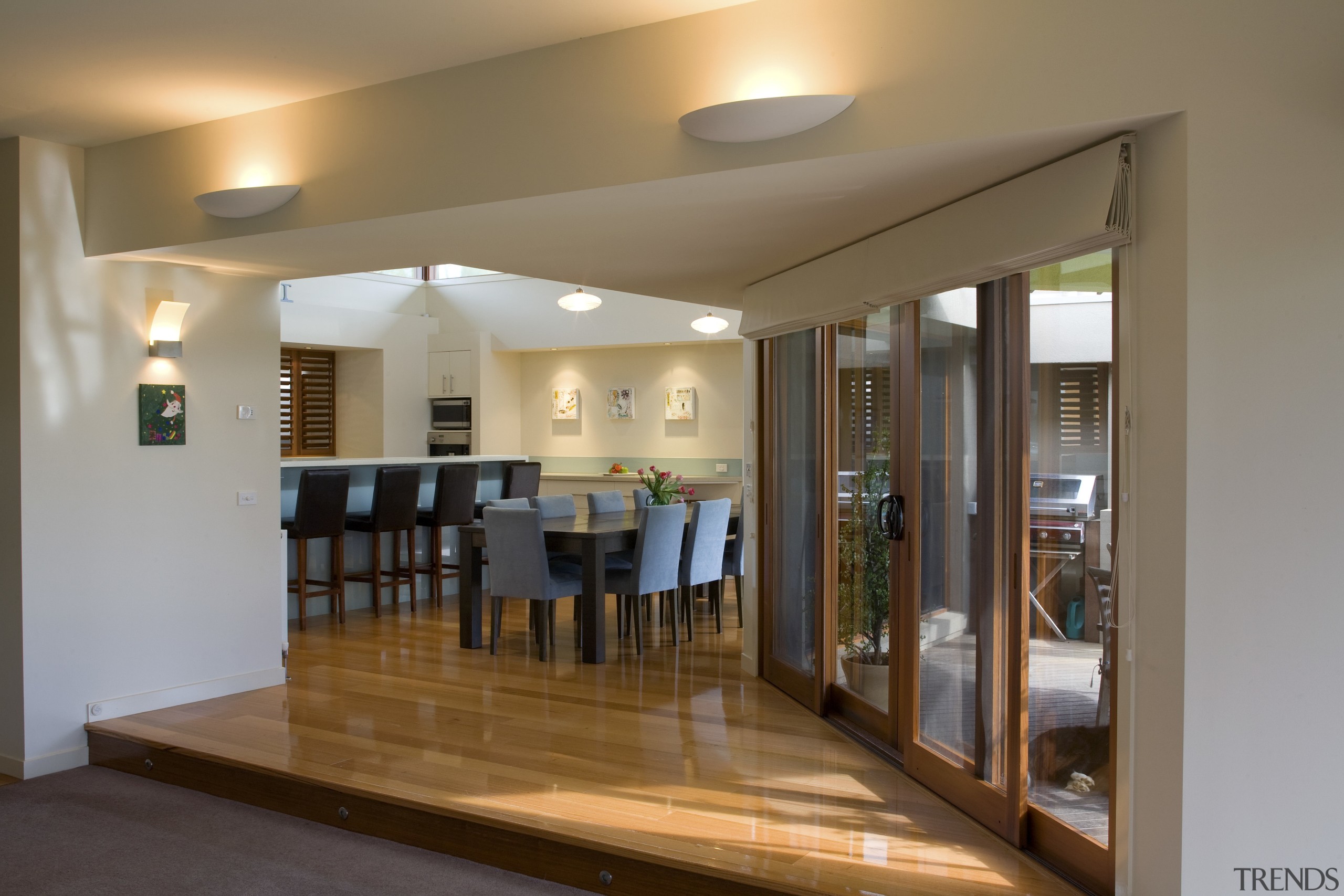 interior kitchen/Dinning area view of a residence which ceiling, floor, flooring, interior design, real estate, room, brown, gray